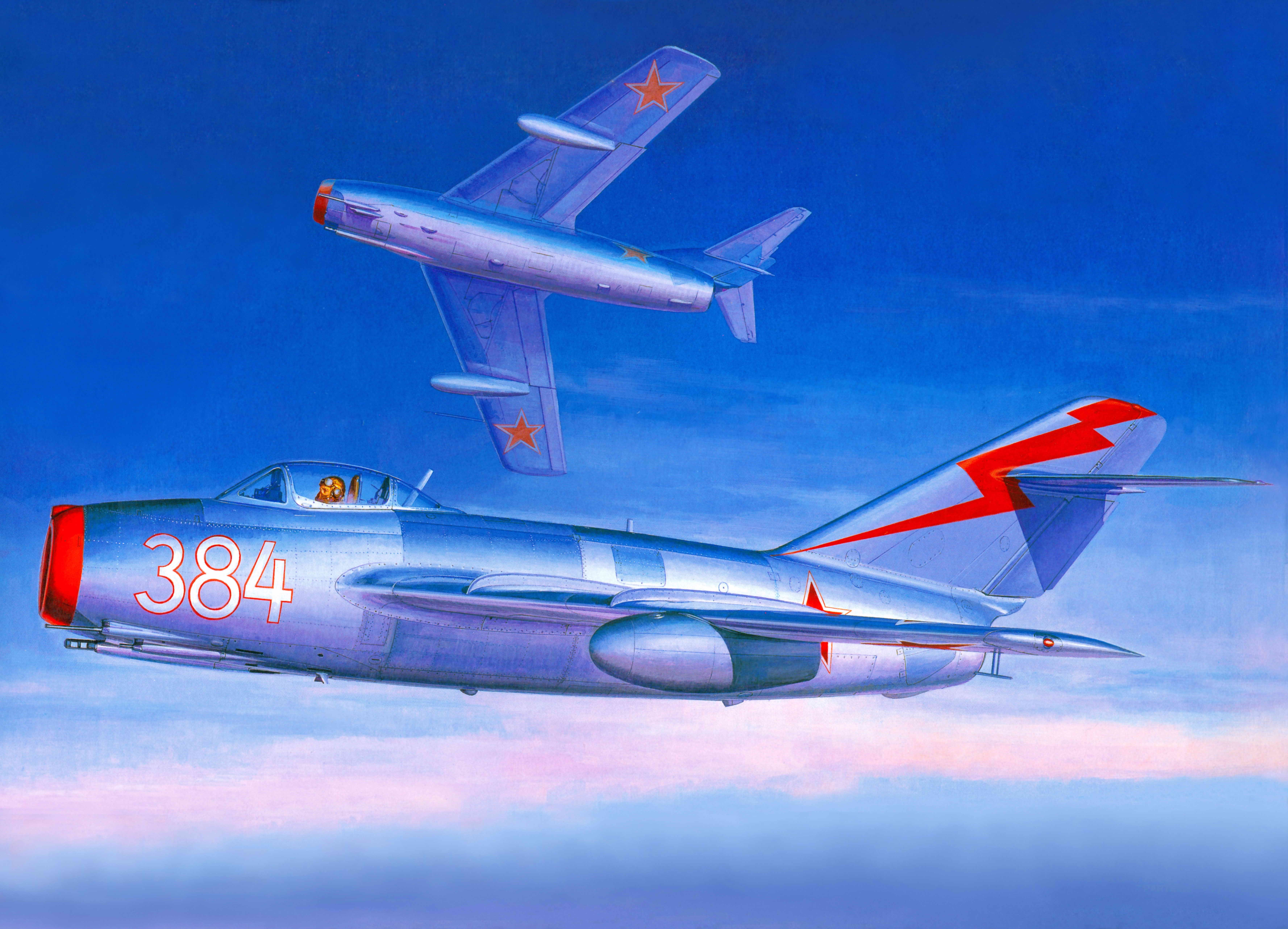 Two Soviet MiG-17 fighter jets in flight HD Wallpaper