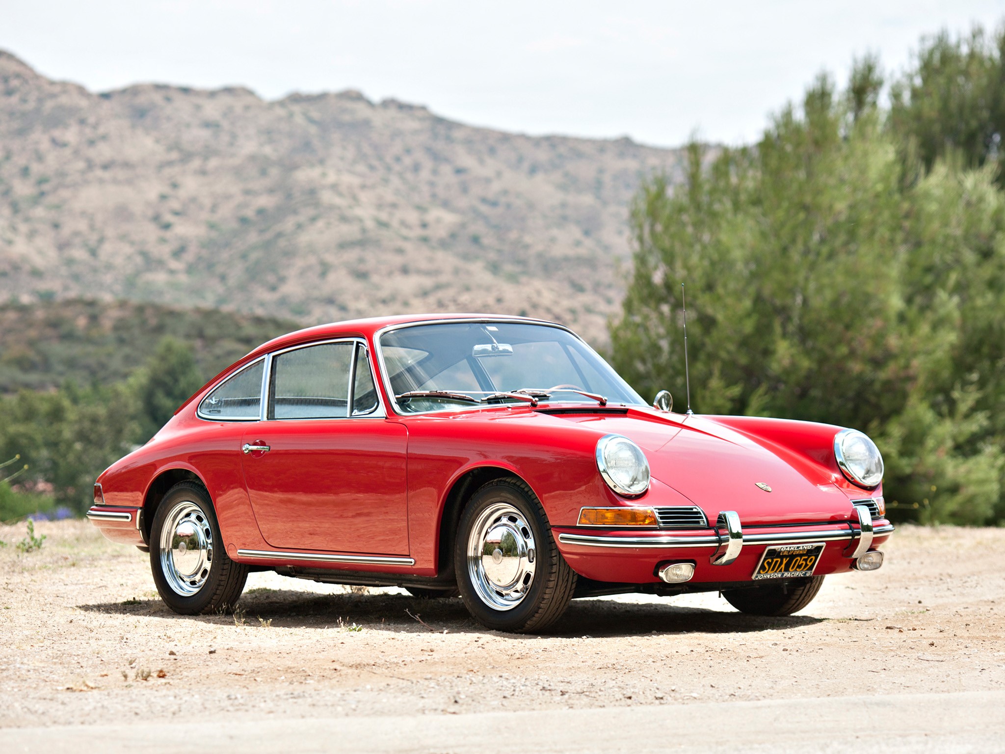 Red Porsche 911 parked on a dirt road HD Wallpaper