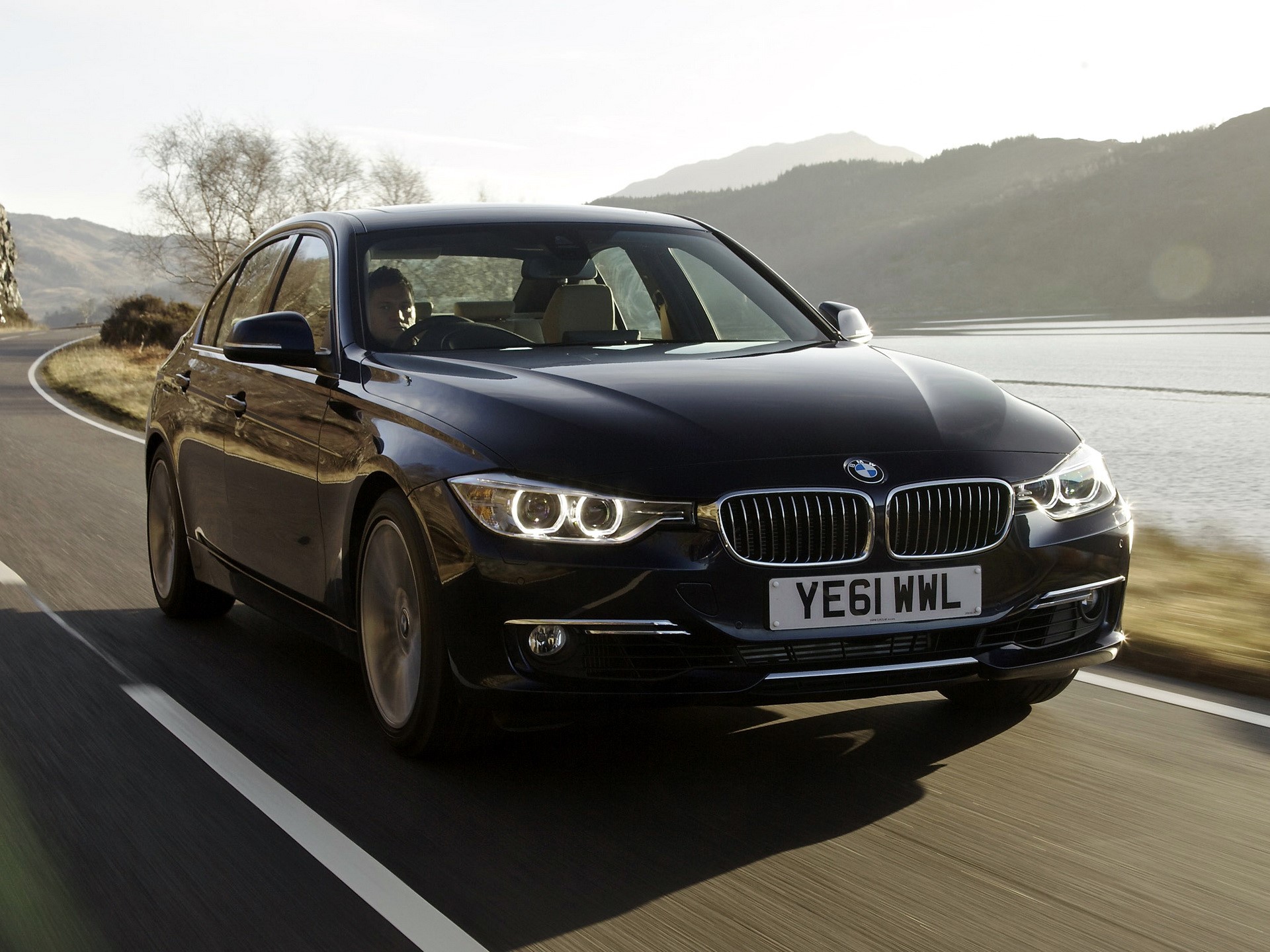 Black BMW Sedan Driving on a Winding Road HD Wallpaper