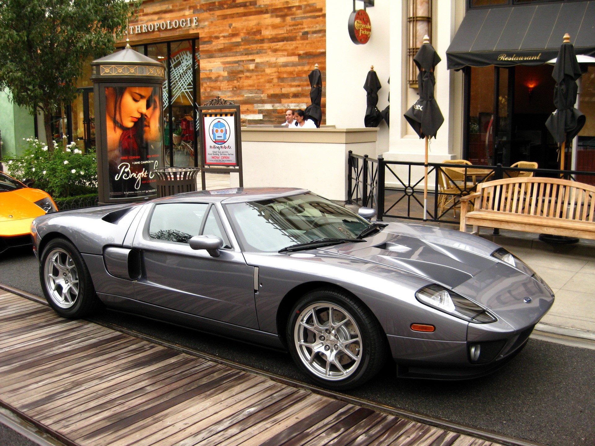 Silver Ford GT parked on wooden planks HD Wallpaper