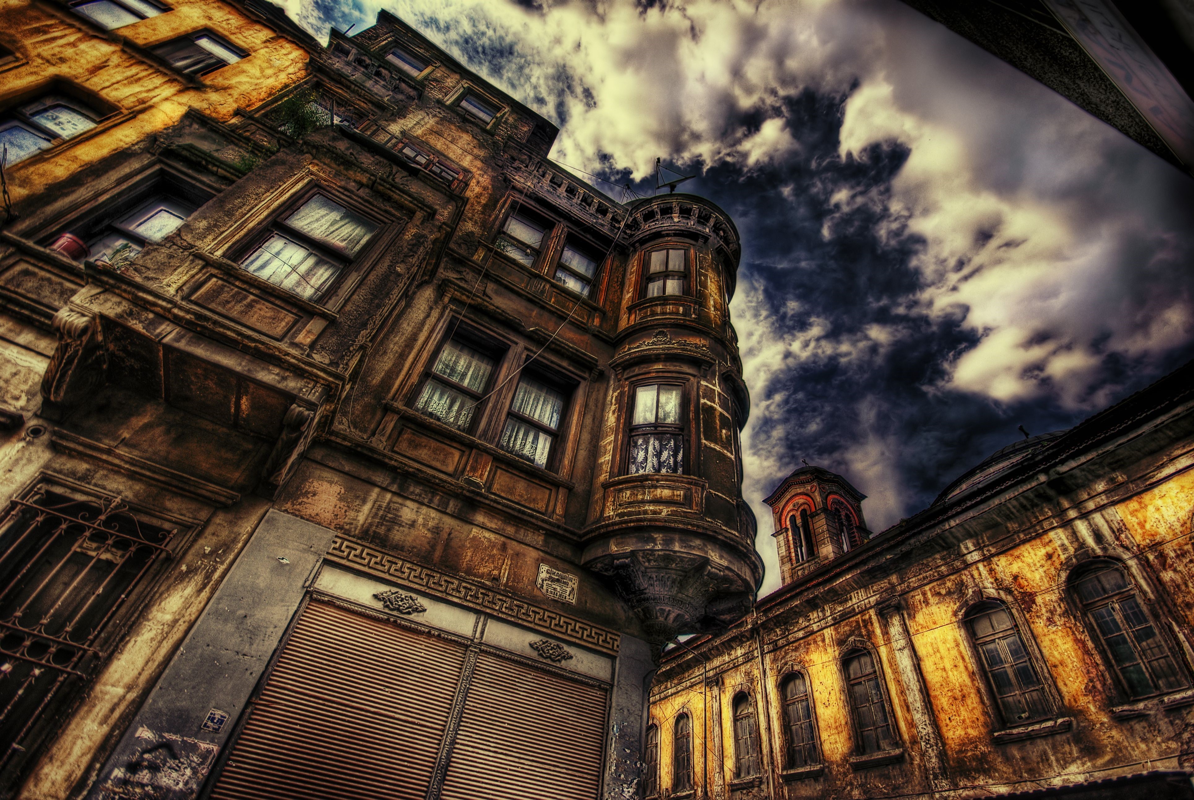 Old Houses Under Dramatic Sky HD Wallpaper