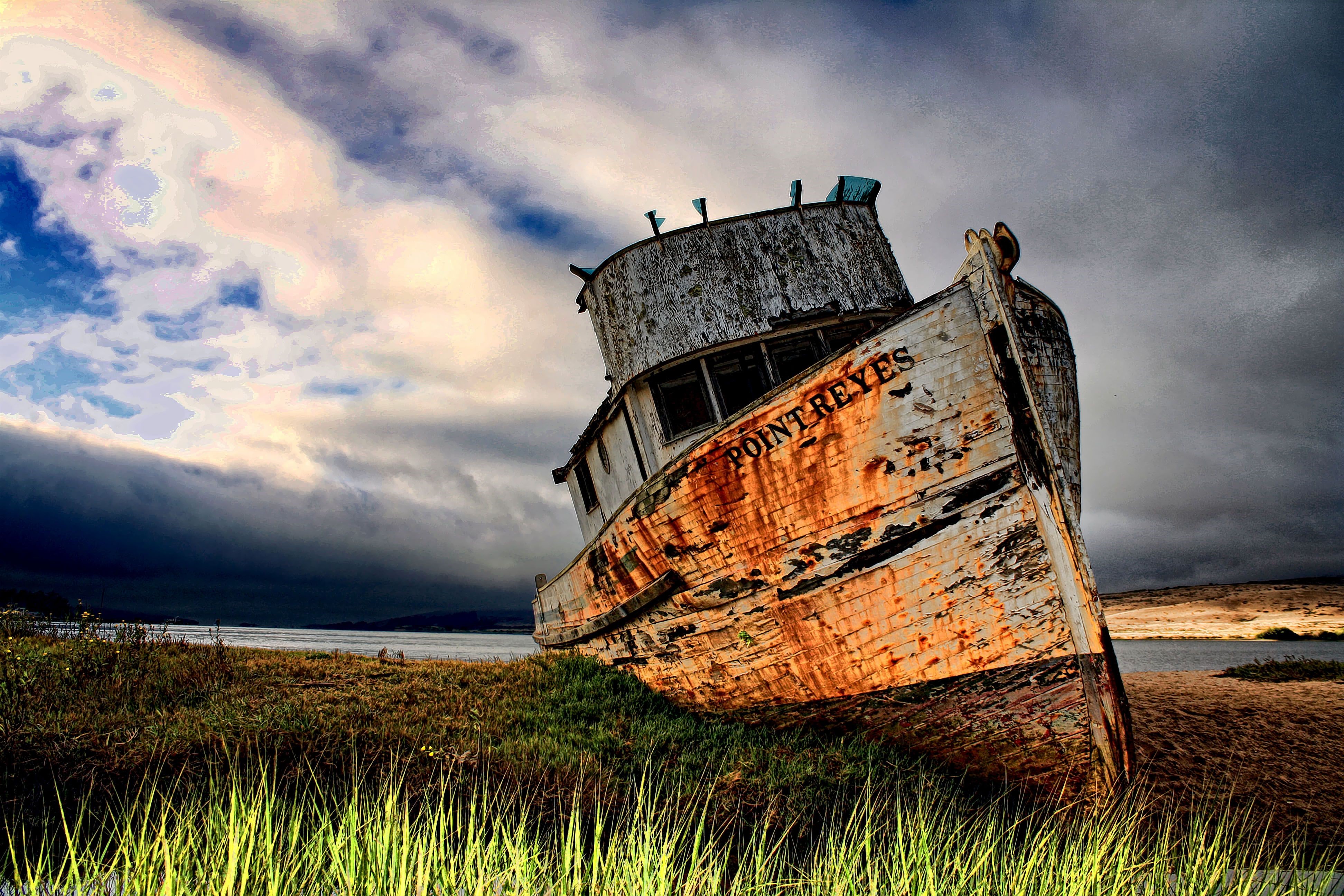 Old shipwrecked boat named Point Reyes on shore HD Wallpaper