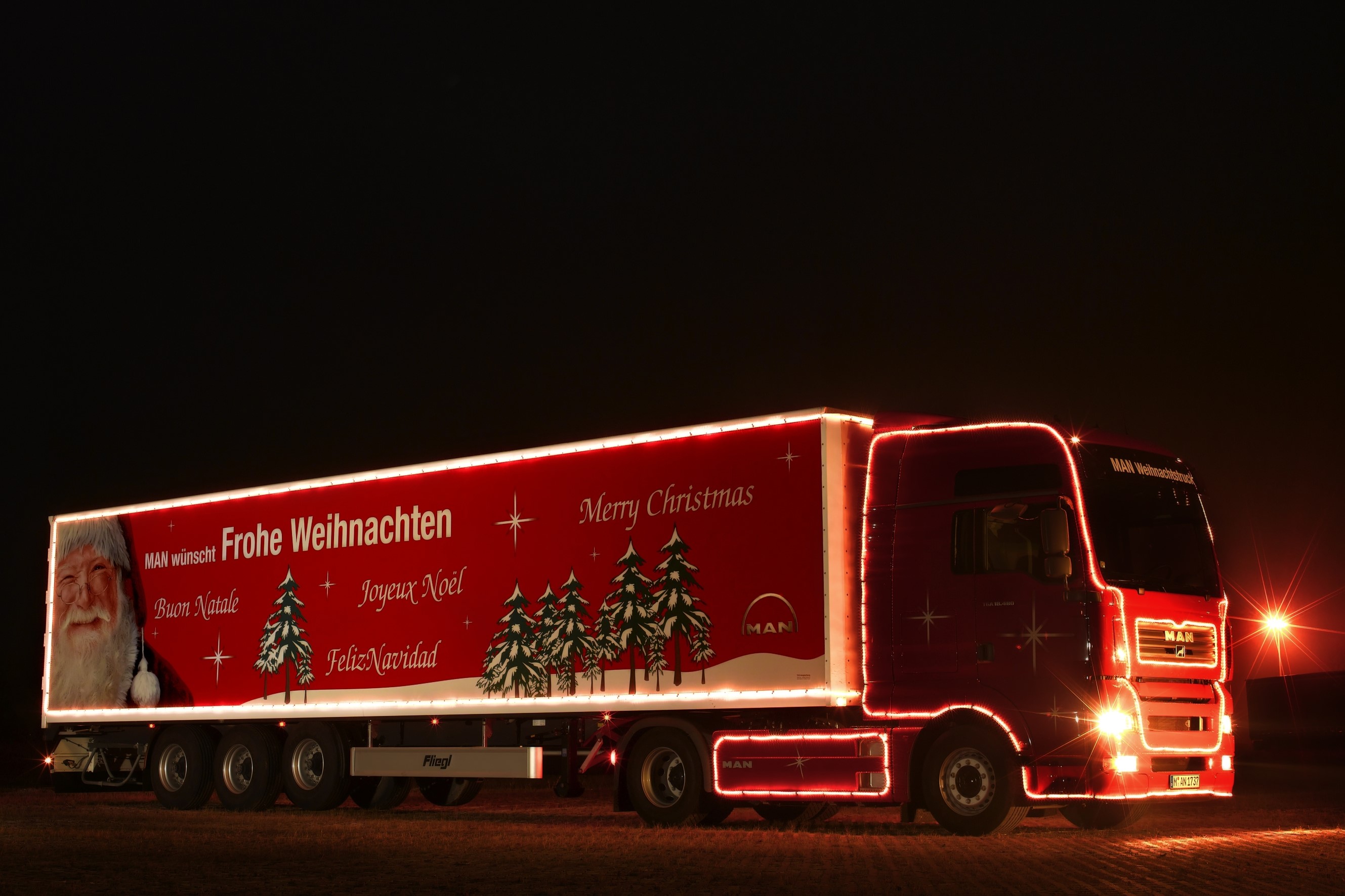 MAN truck decorated with Christmas lights HD Wallpaper