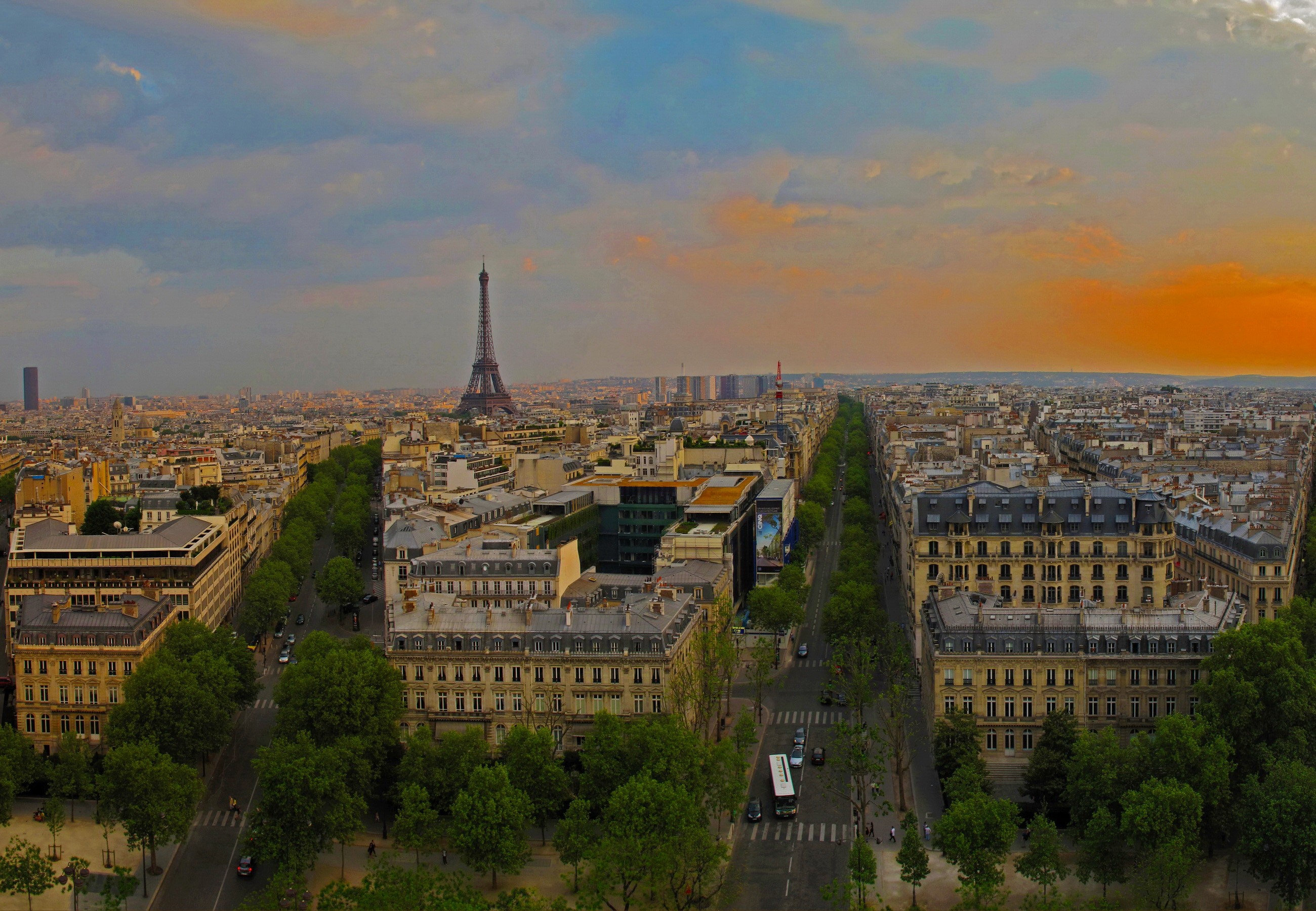 Parisian cityscape with Eiffel Tower at sunset HD Wallpaper