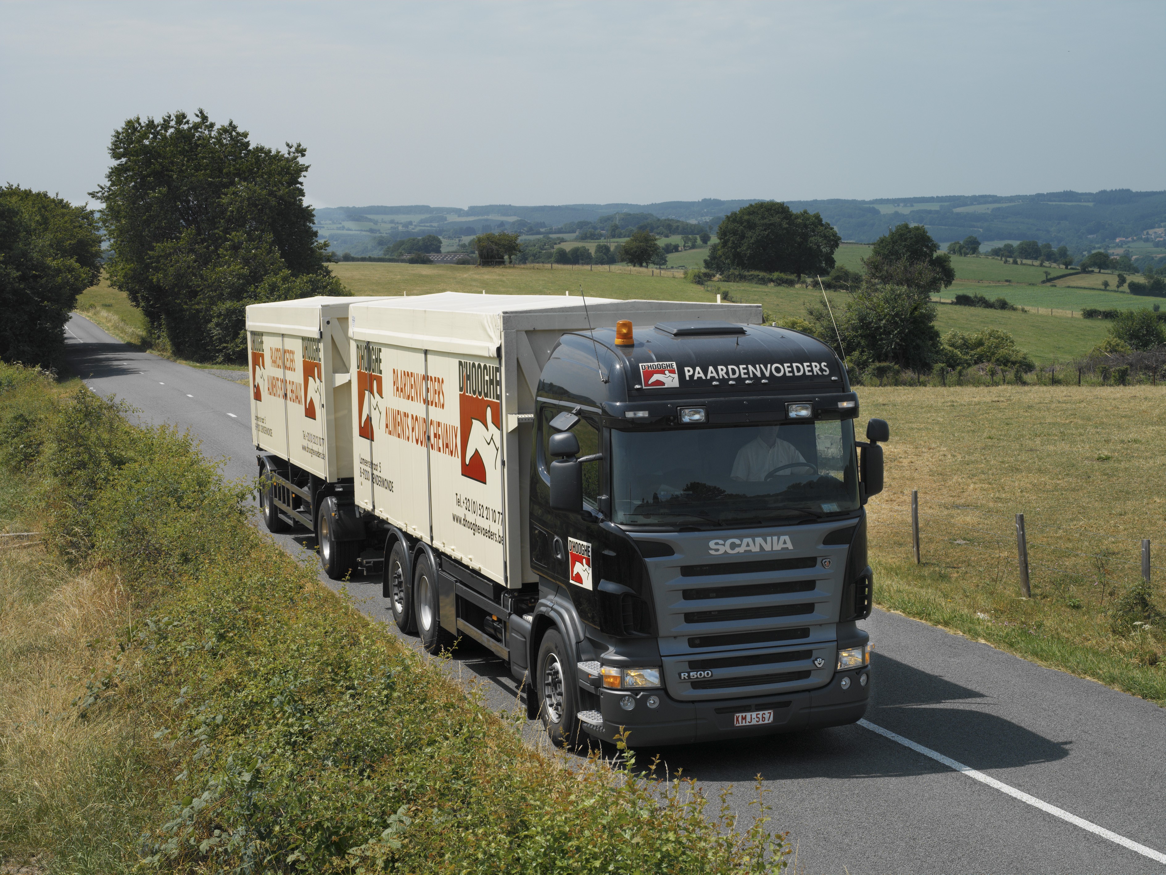 Scania truck with Paardenvoeders trailer on a road HD Wallpaper
