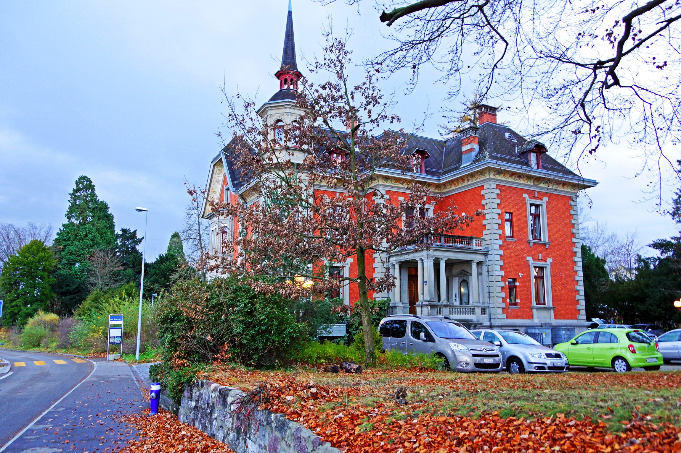 Red brick house with a spire in Switzerland HD Wallpaper