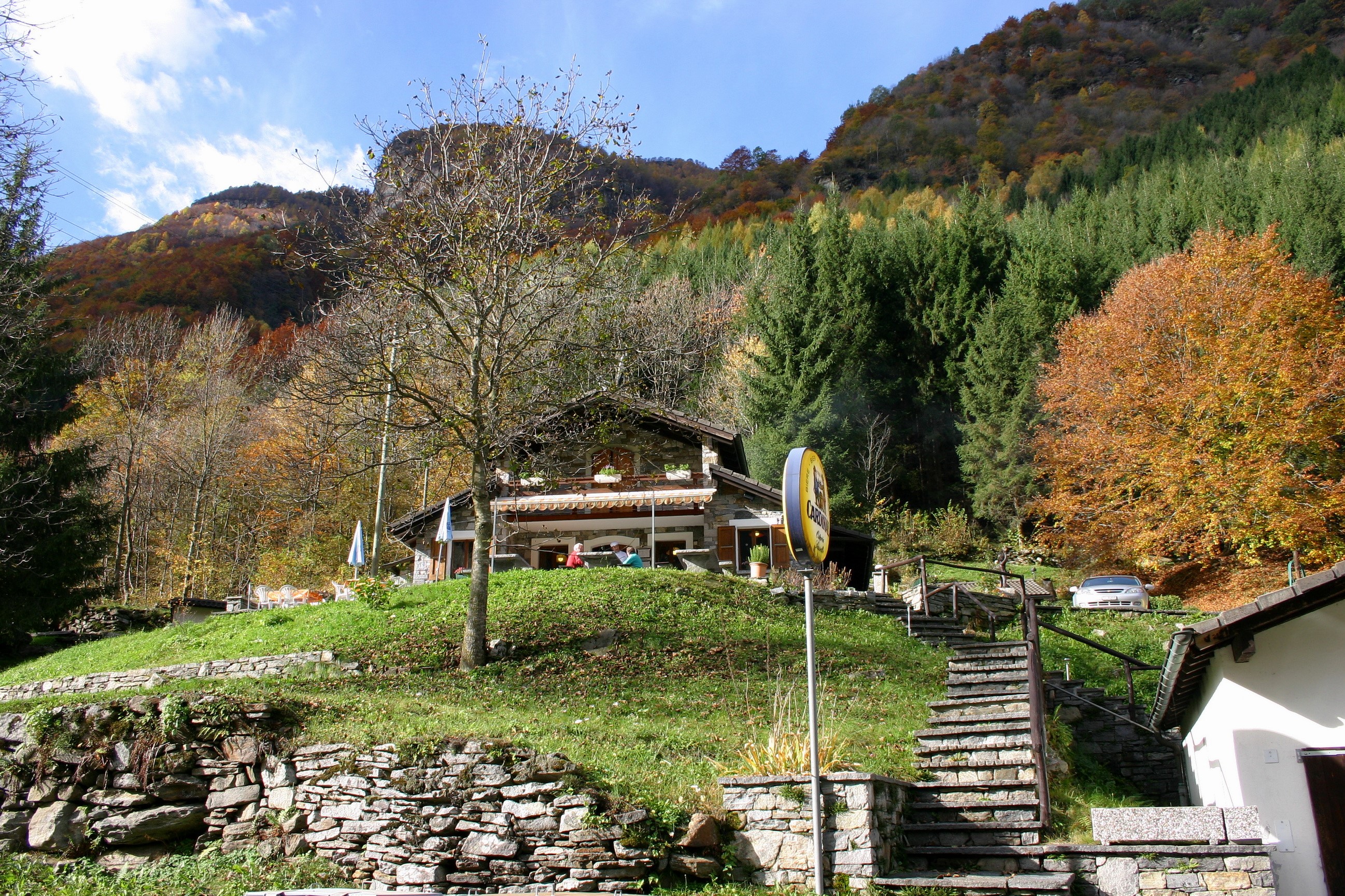 Stone house in Gerra (Verzasca), Ticino, Switzerland during autumn HD Wallpaper