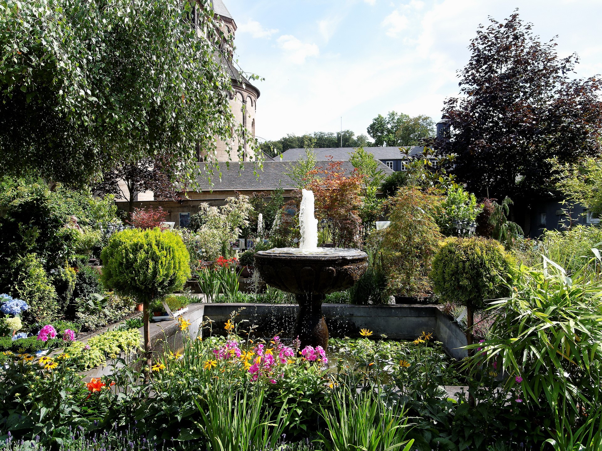 Garden with fountain and flowers HD Wallpaper