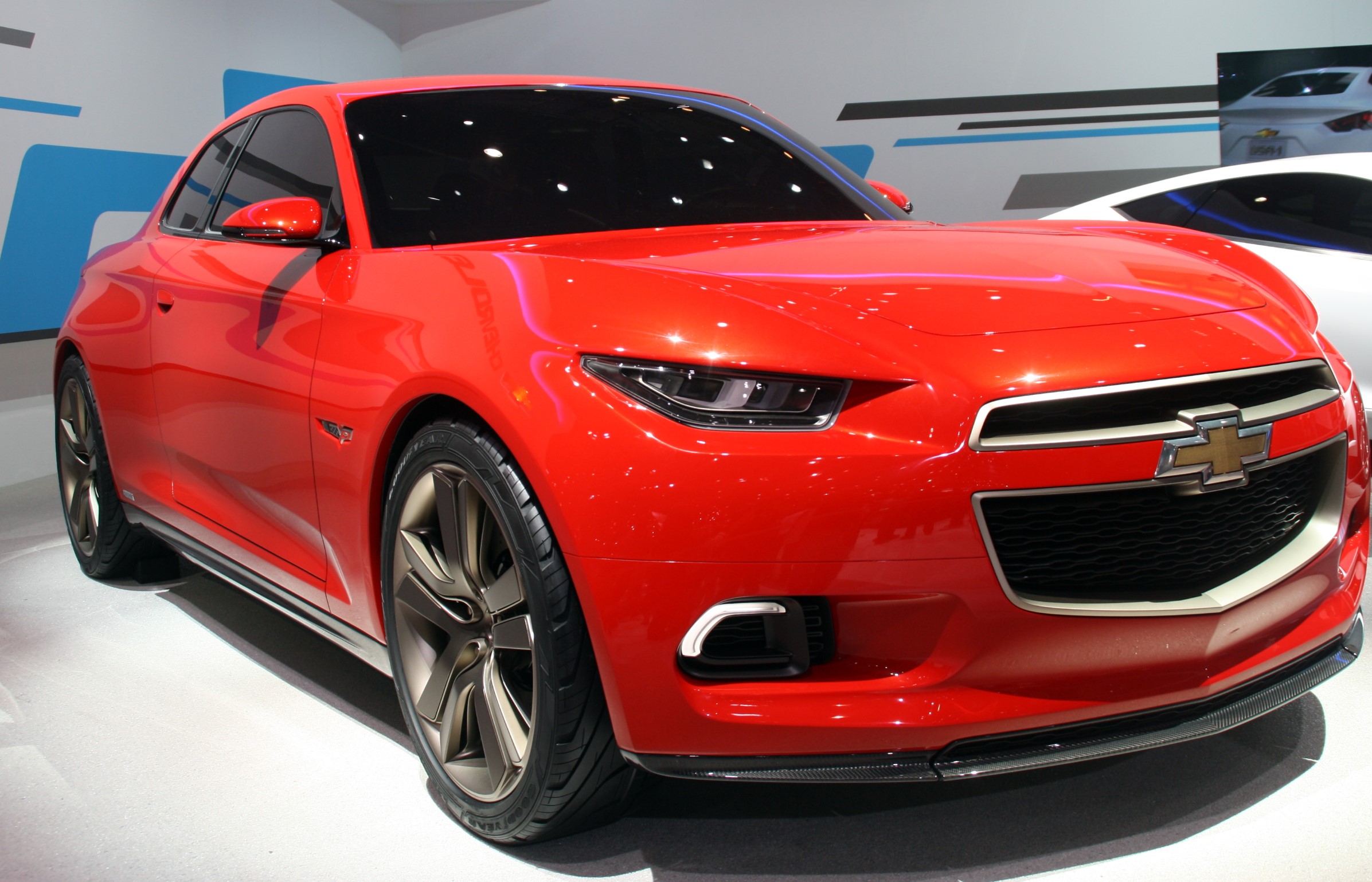 Red Chevrolet concept car on display HD Wallpaper