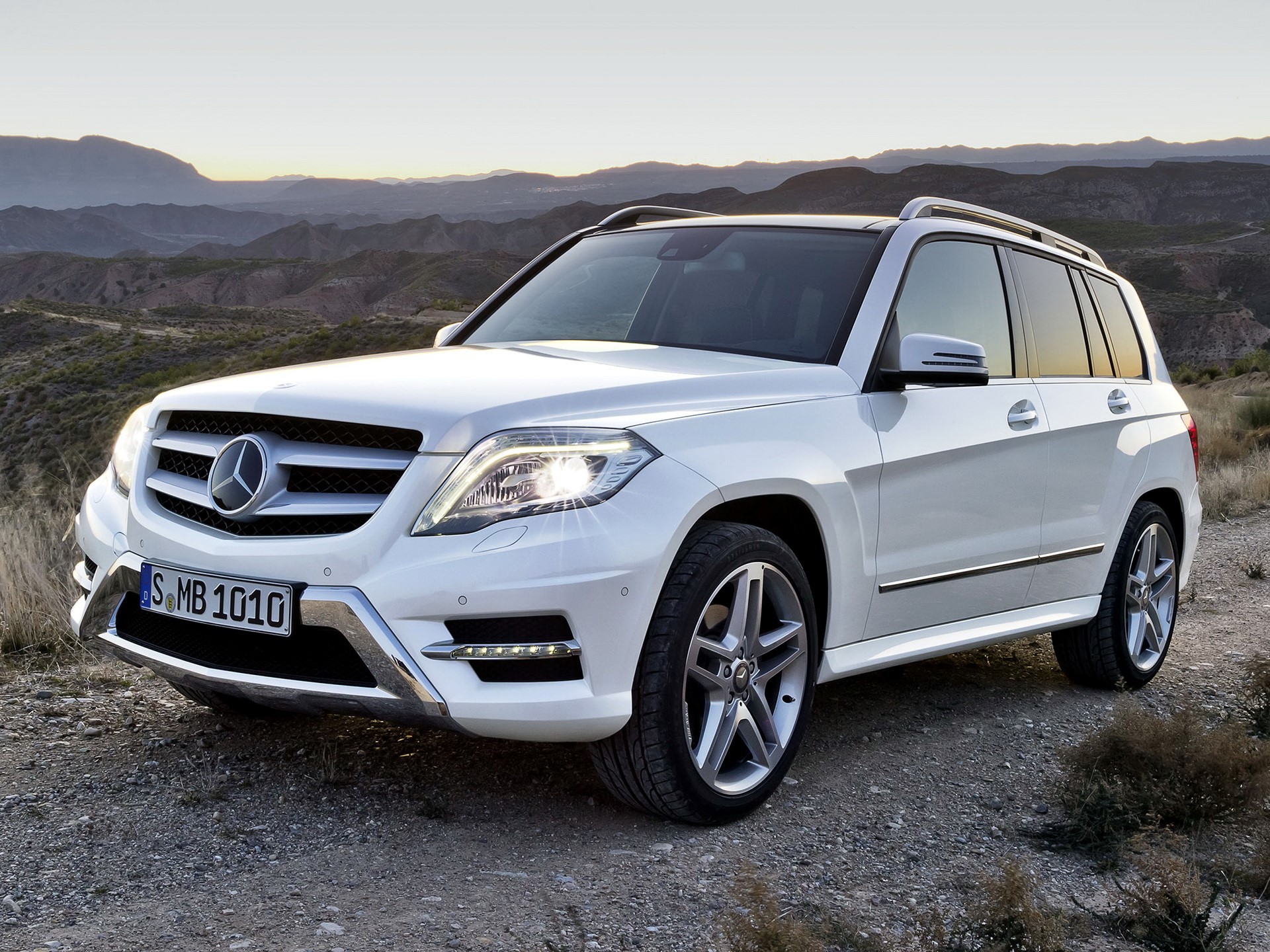 White Mercedes-Benz GLK SUV on a dirt road HD Wallpaper