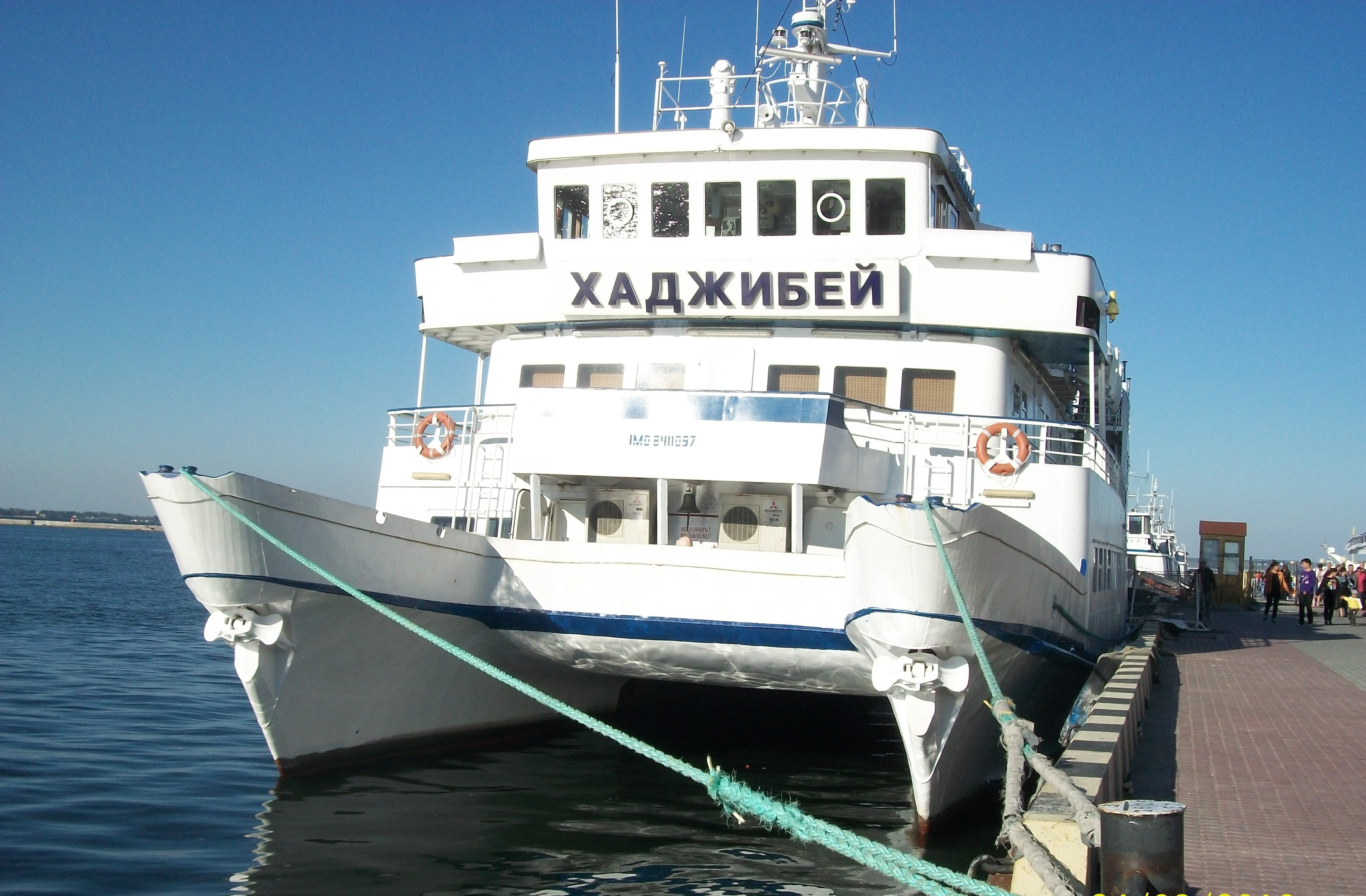 White catamaran ship named Khadzhibey docked at pier HD Wallpaper