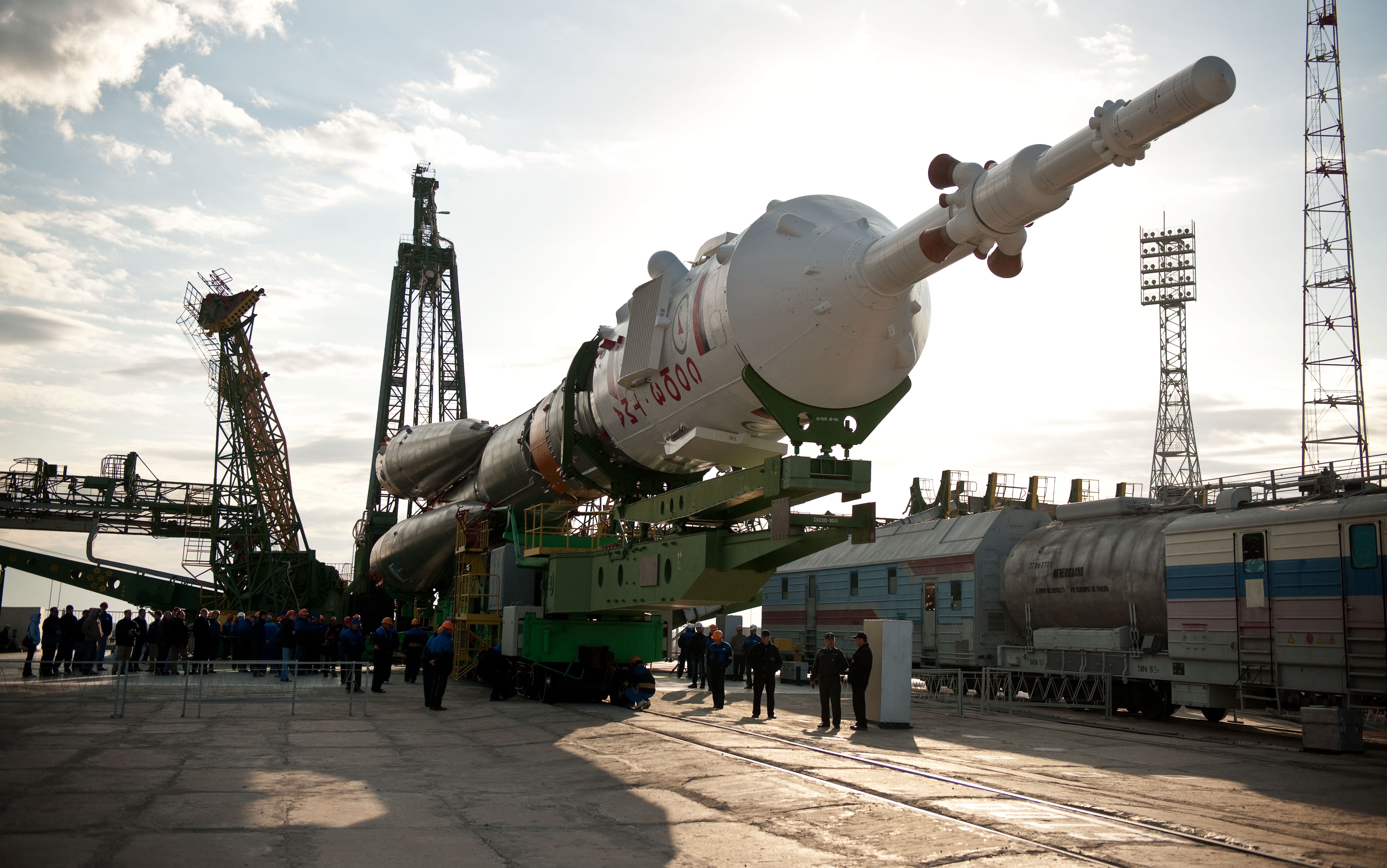 Soyuz rocket on launchpad with launch towers HD Wallpaper