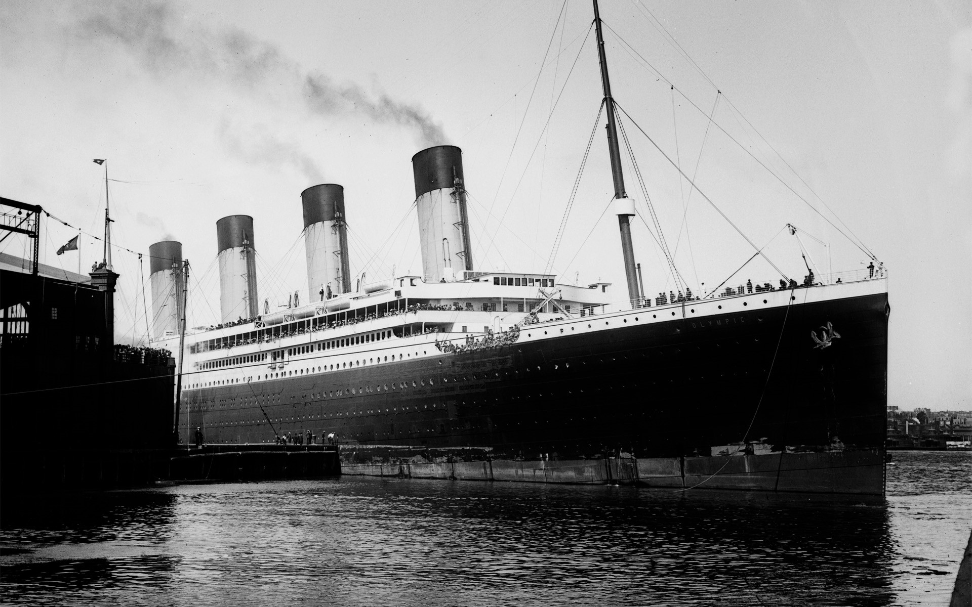 RMS Olympic docked next to a pier HD Wallpaper