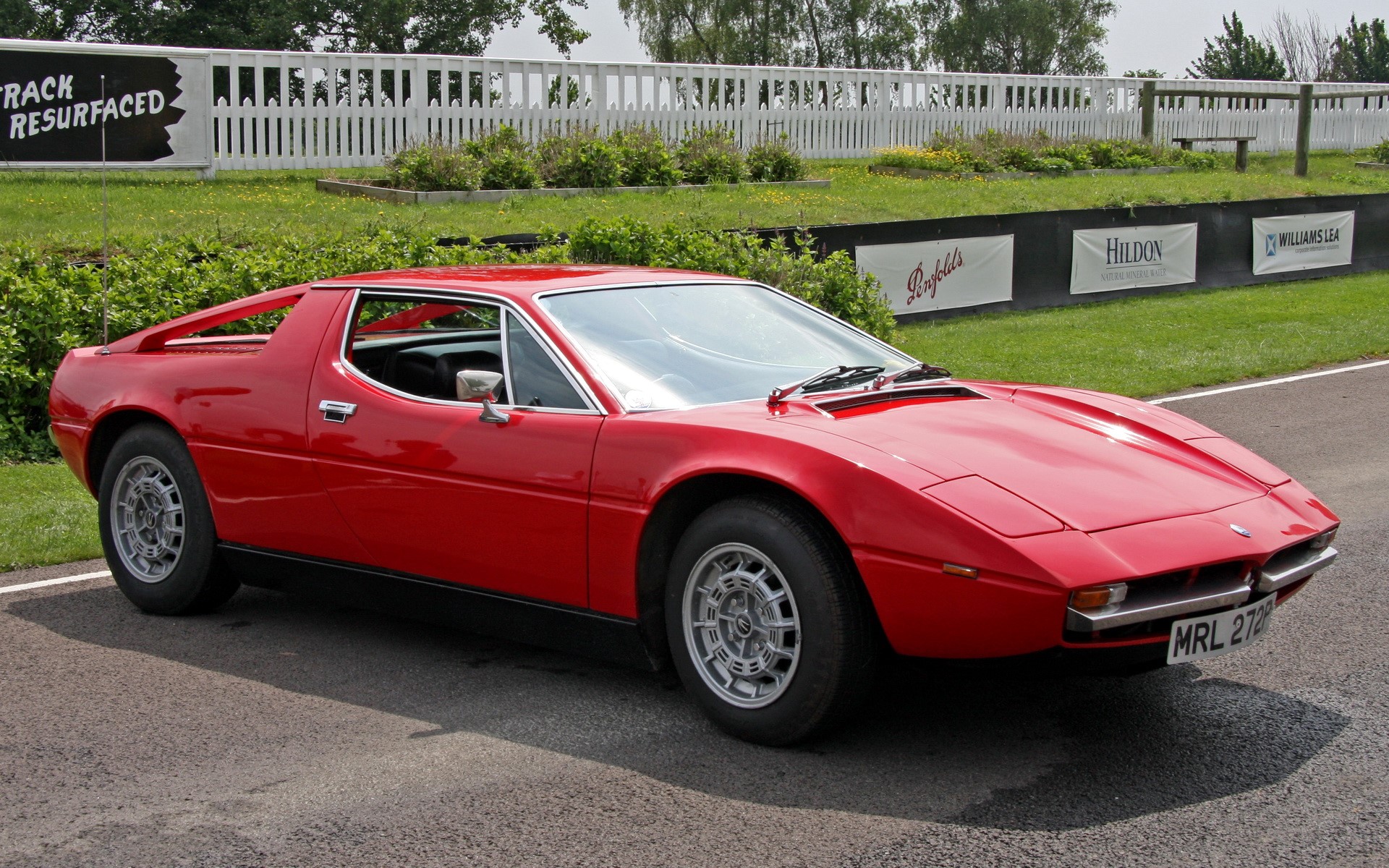 Red Maserati Merak on a Race Track HD Wallpaper