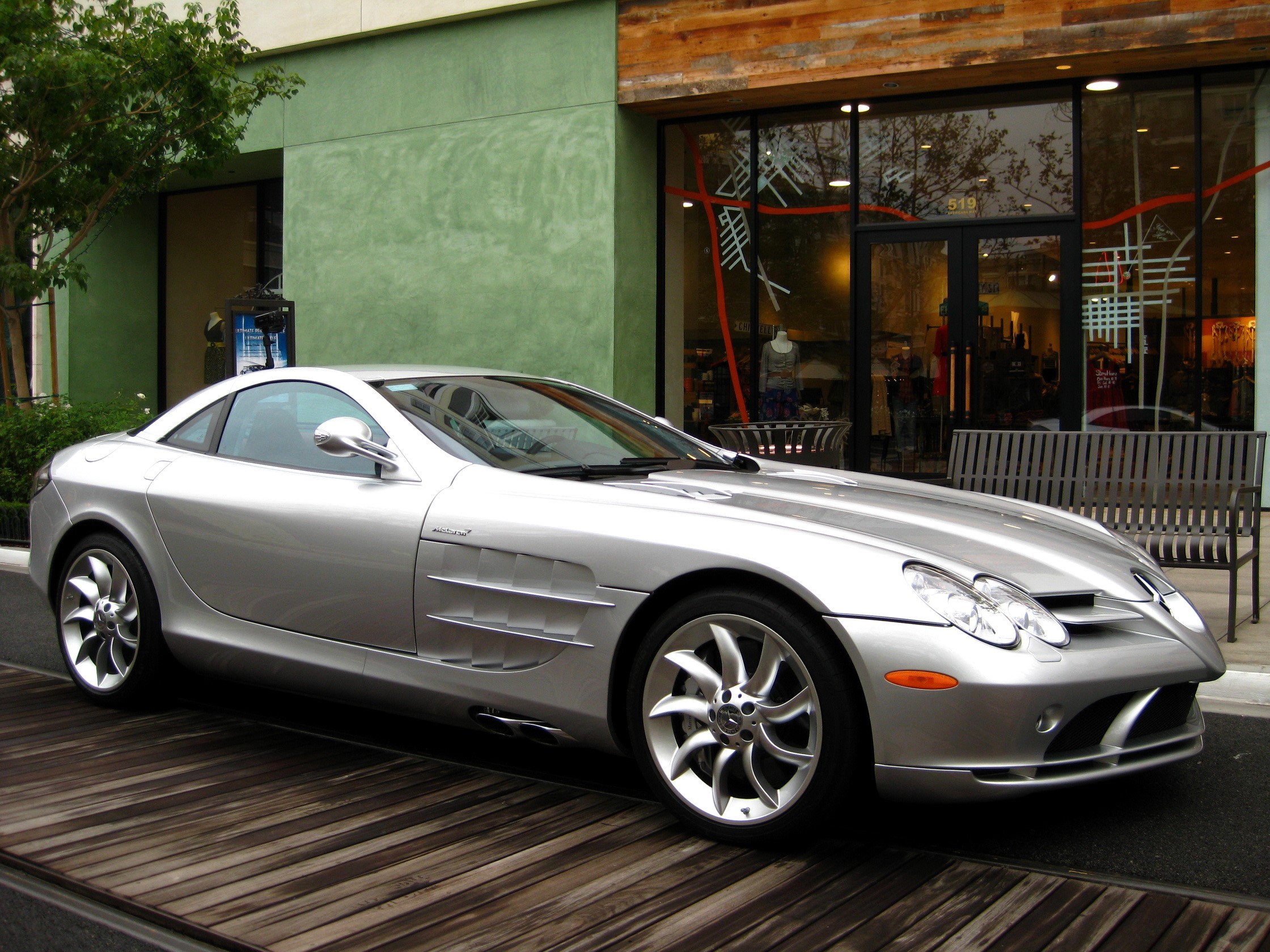 Silver Mercedes-Benz SLR McLaren parked on wooden planks HD Wallpaper