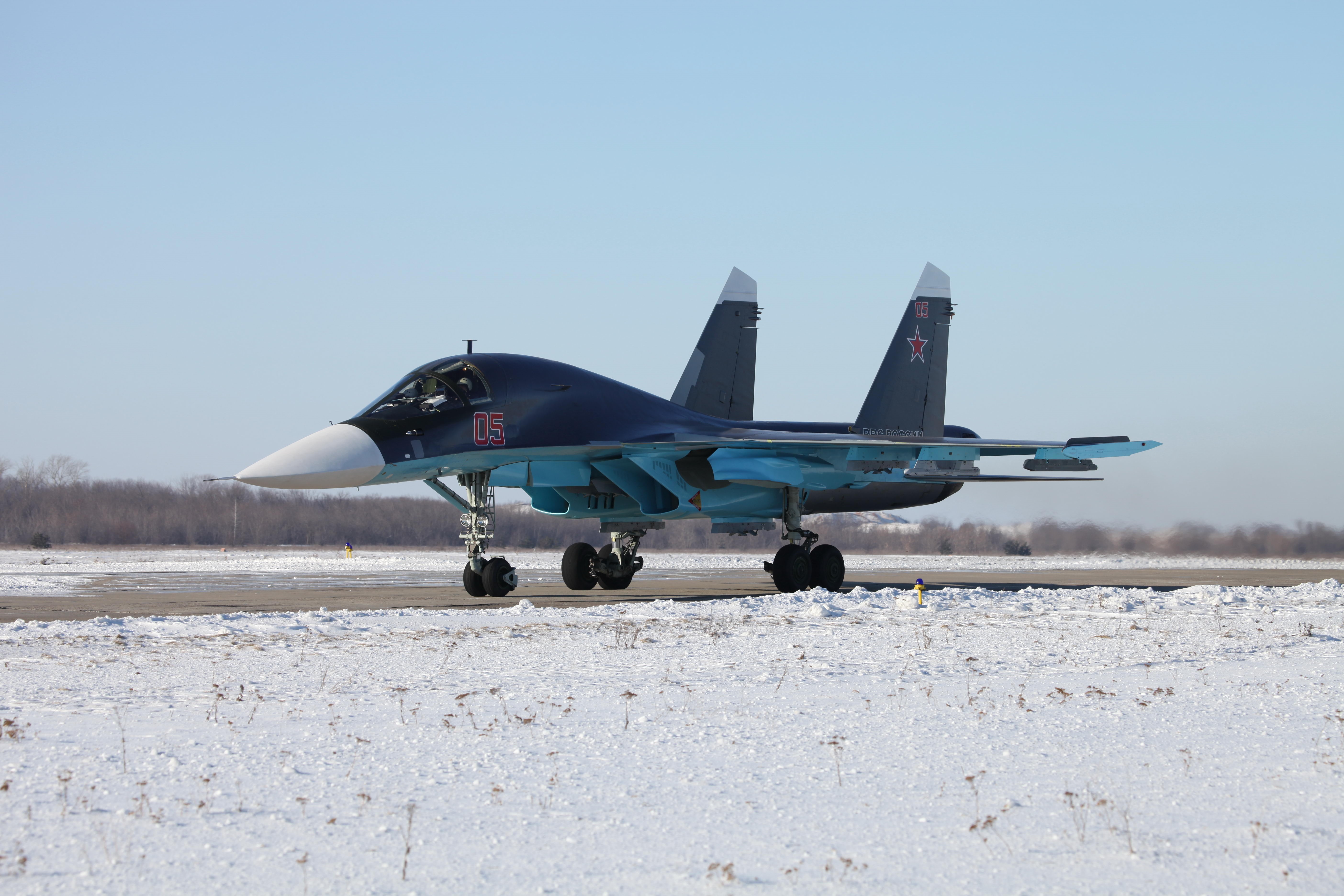Sukhoi Su-34 fighter jet on a runway HD Wallpaper