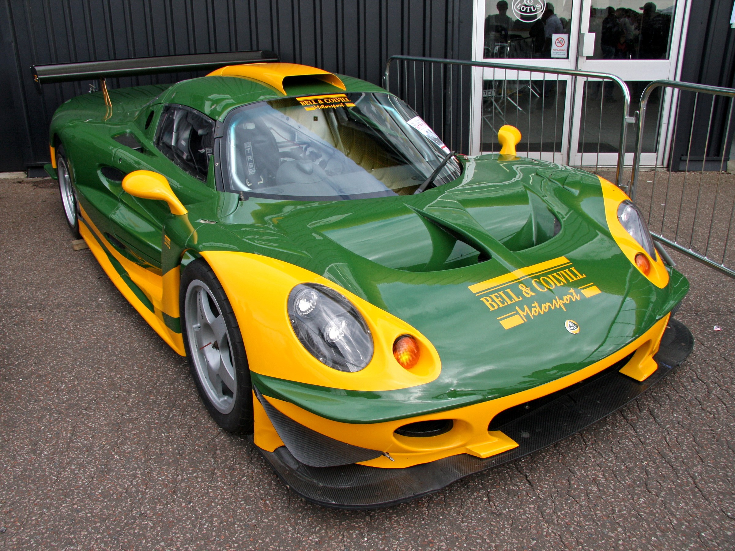 Green and yellow Lotus Elise race car HD Wallpaper