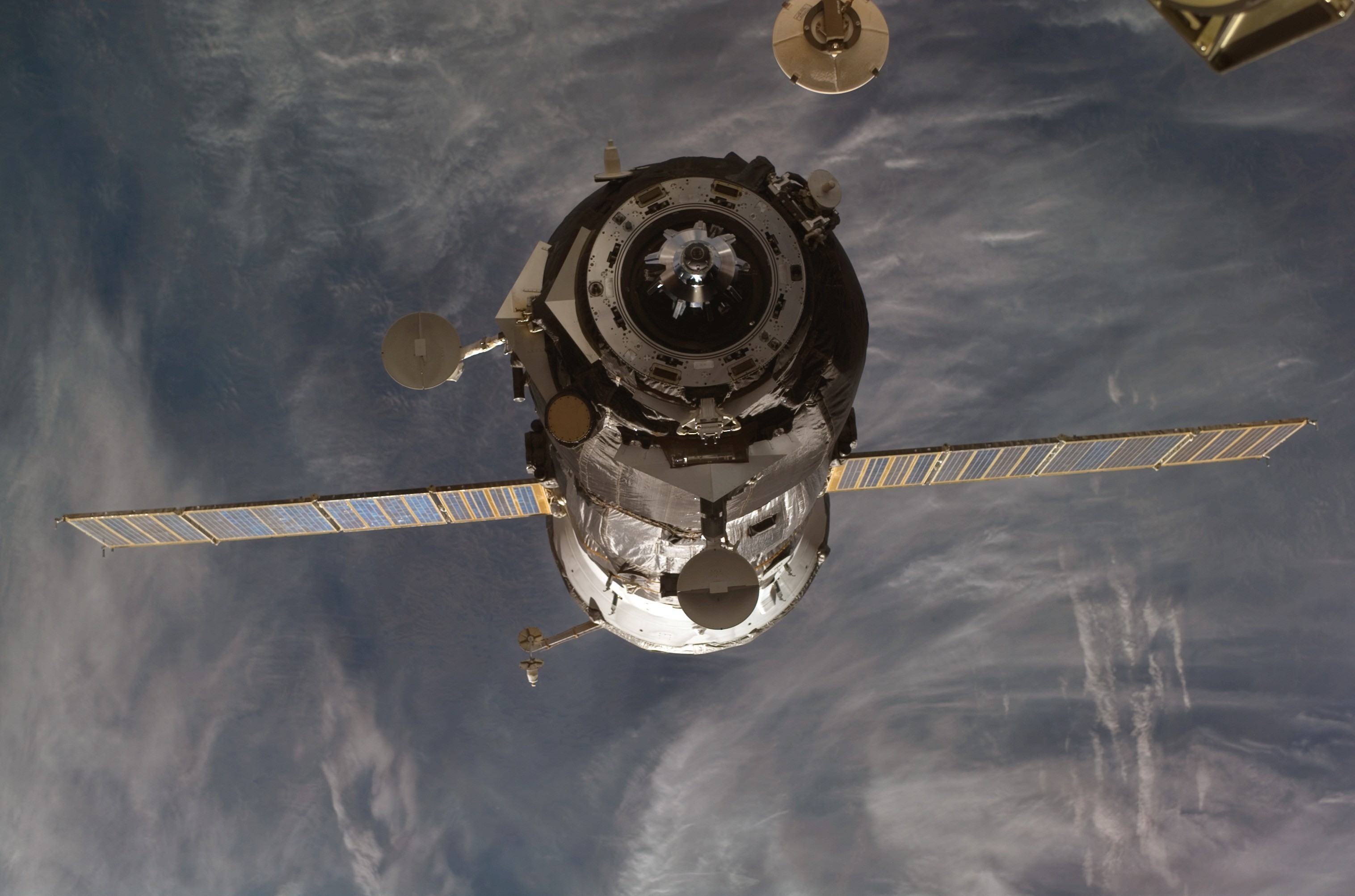 Spacecraft docked with International Space Station HD Wallpaper