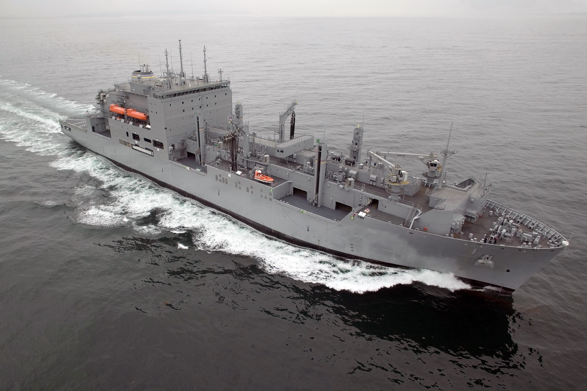 A large gray naval ship sailing on the ocean HD Wallpaper