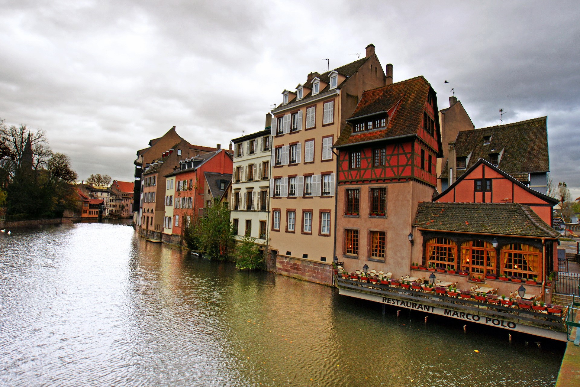 Buildings along a canal in France HD Wallpaper