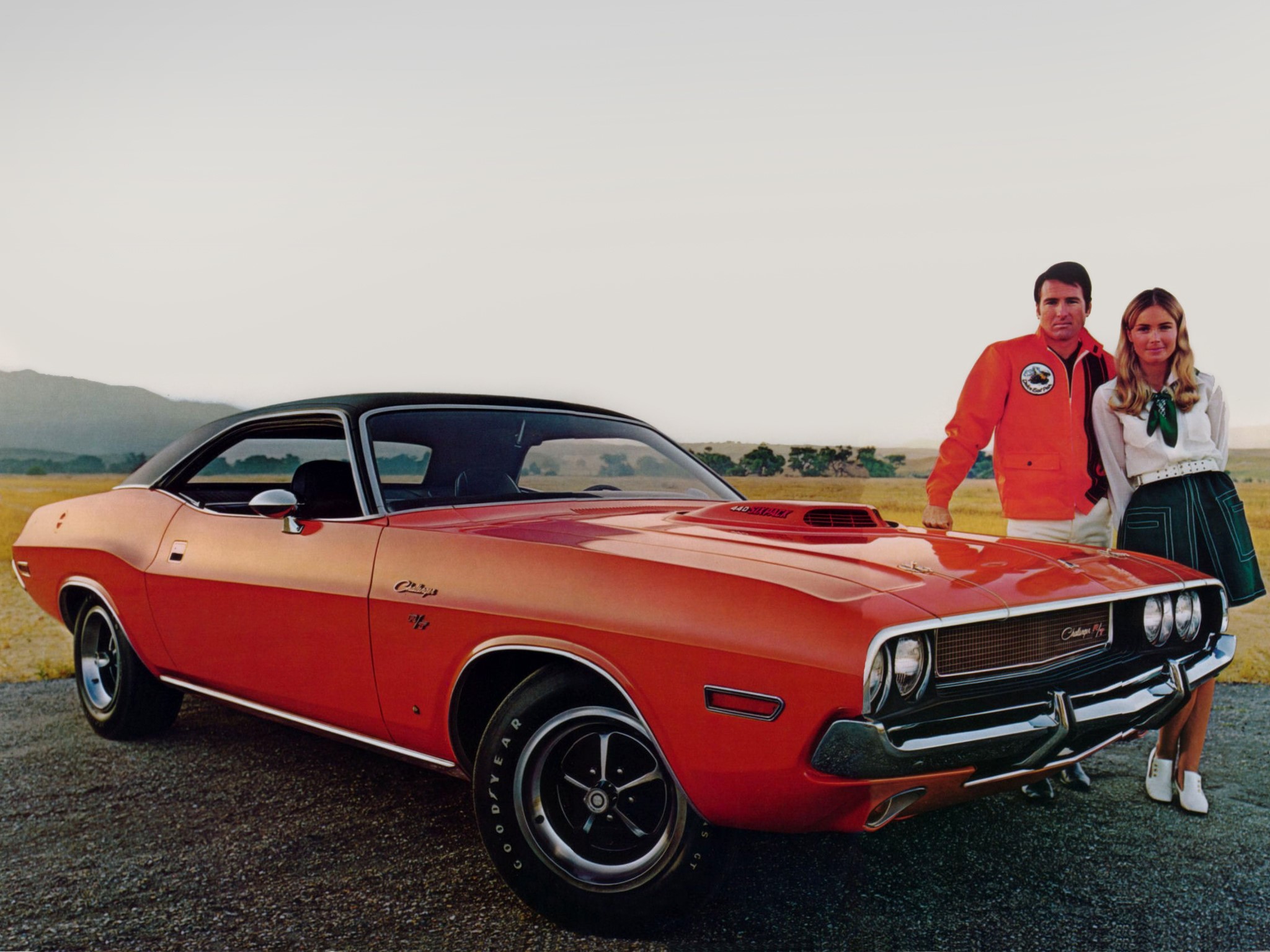1970 Dodge Challenger R/T with a man and woman HD Wallpaper
