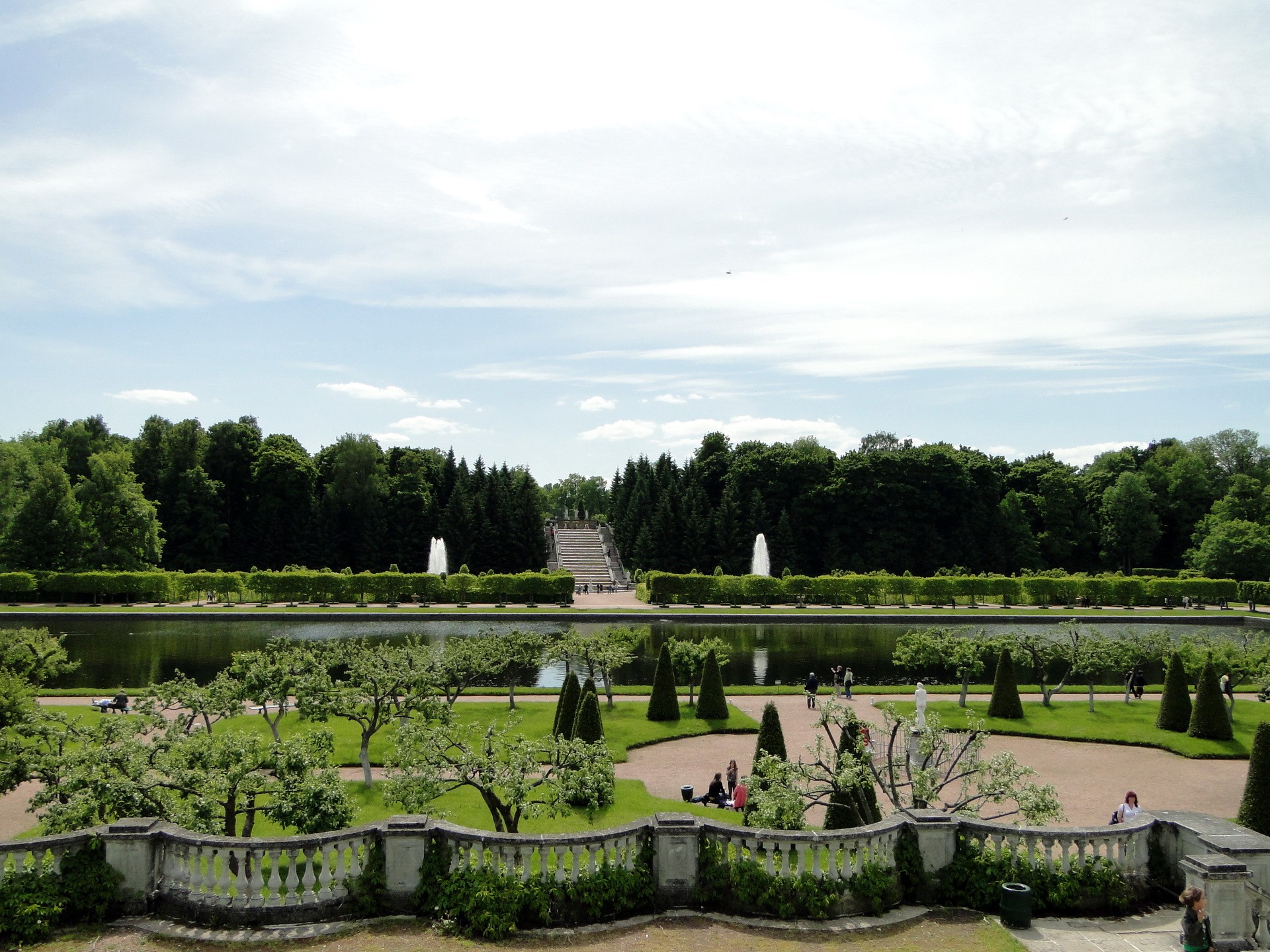 Grand park with fountains and manicured trees HD Wallpaper