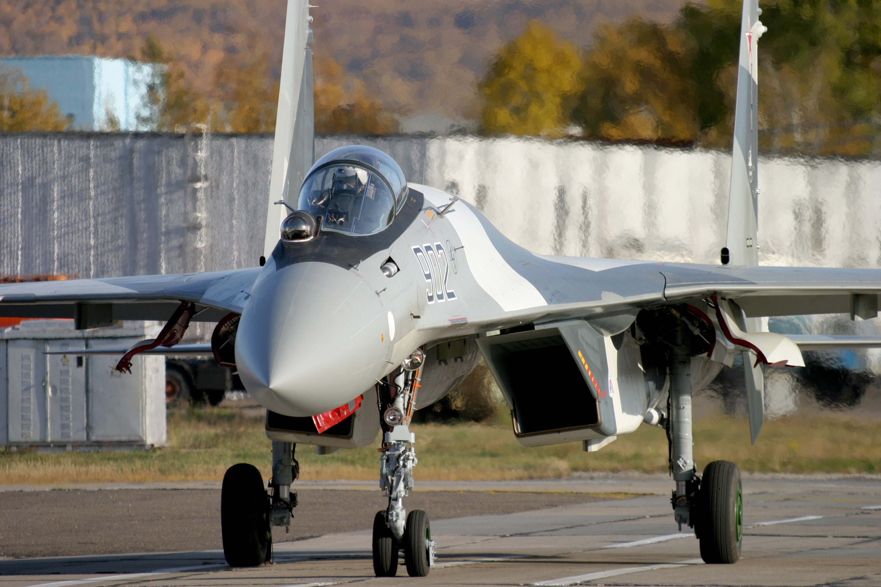 Sukhoi Su-35 fighter jet on tarmac HD Wallpaper