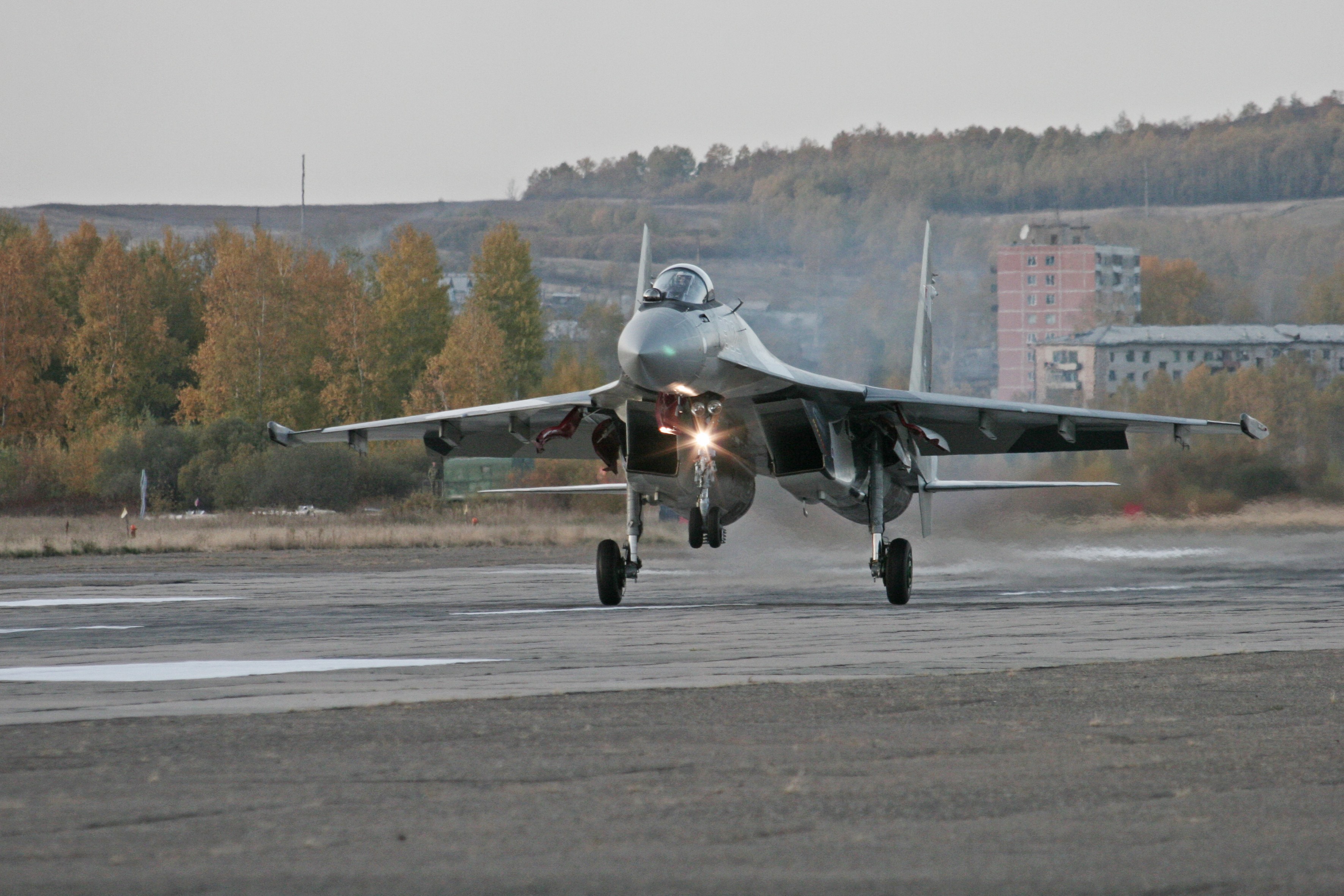 Sukhoi Su-35 fighter jet landing on runway HD Wallpaper