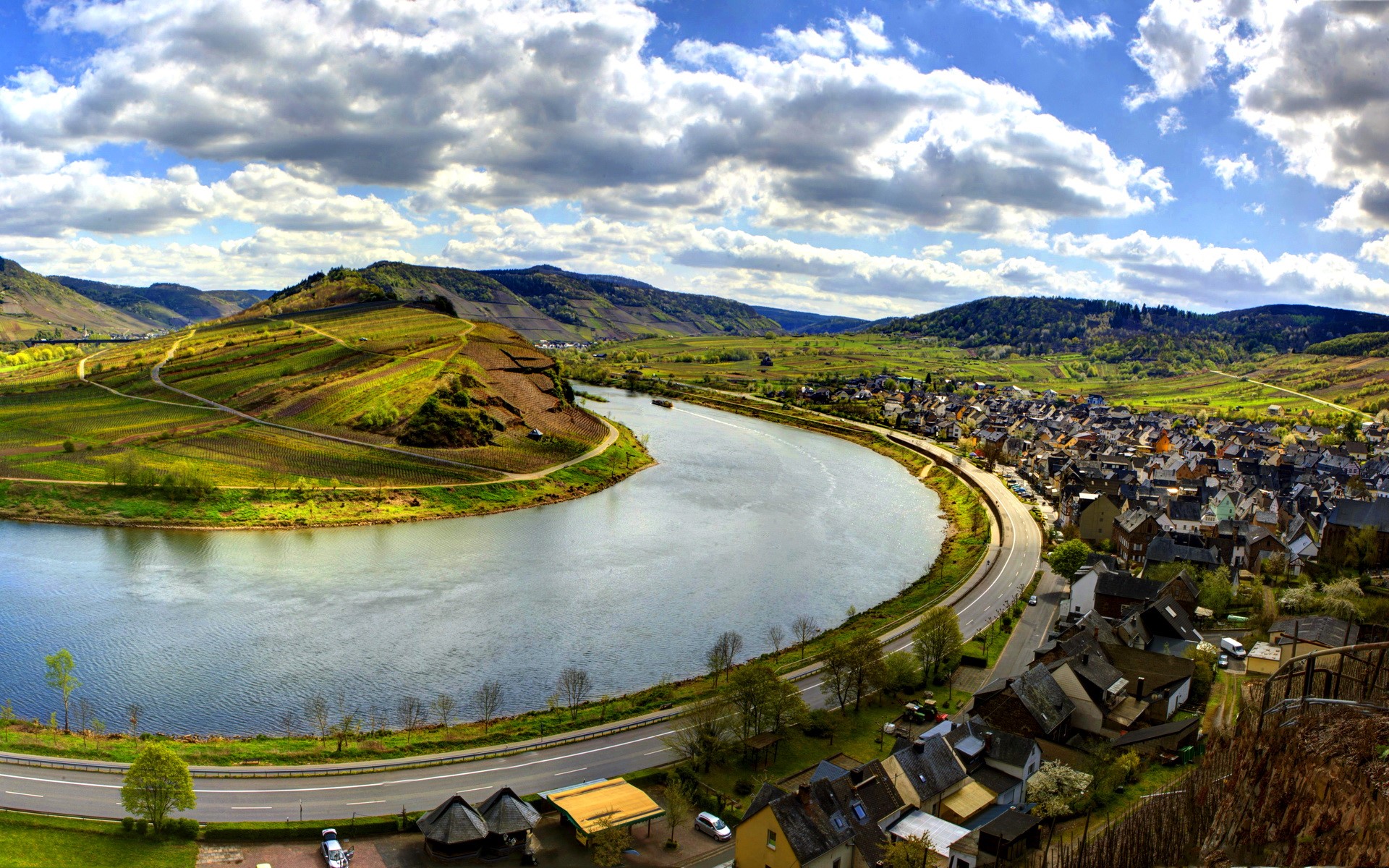 River bend with vineyards and town in Germany HD Wallpaper