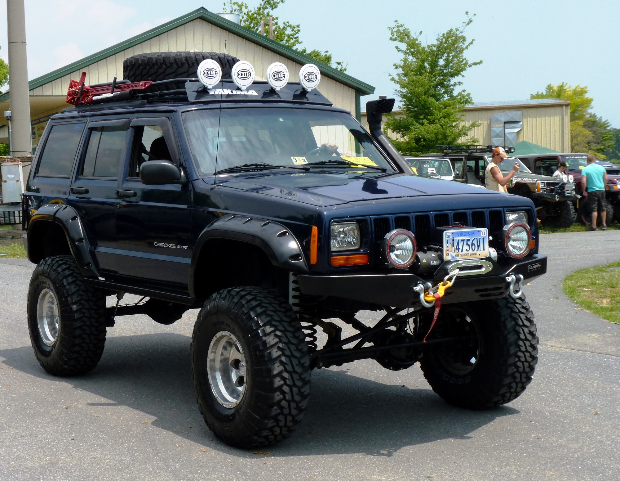 Dark Blue Jeep Cherokee Sport with Off-Road Modifications HD Wallpaper