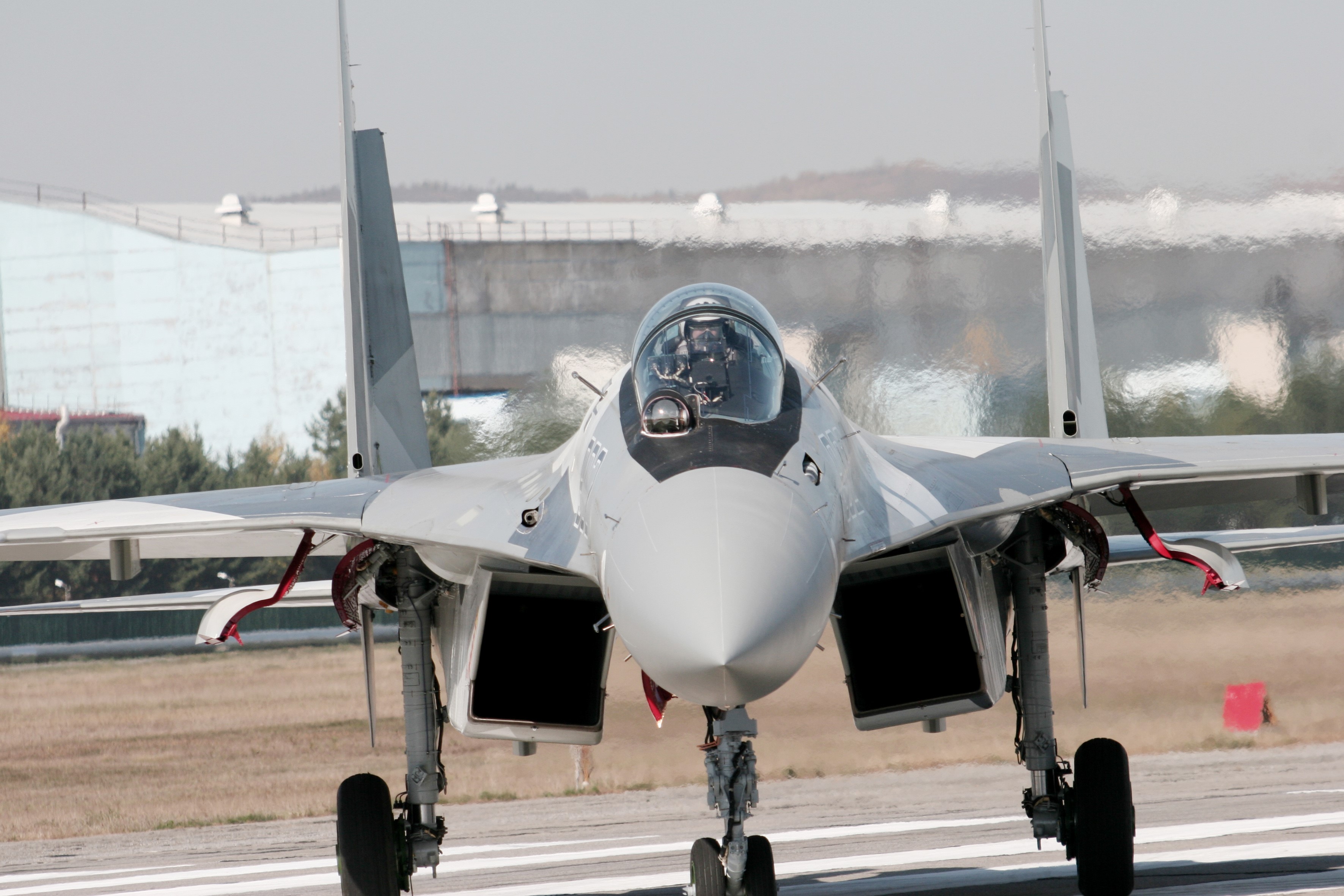 Sukhoi Su-35 fighter jet on runway HD Wallpaper