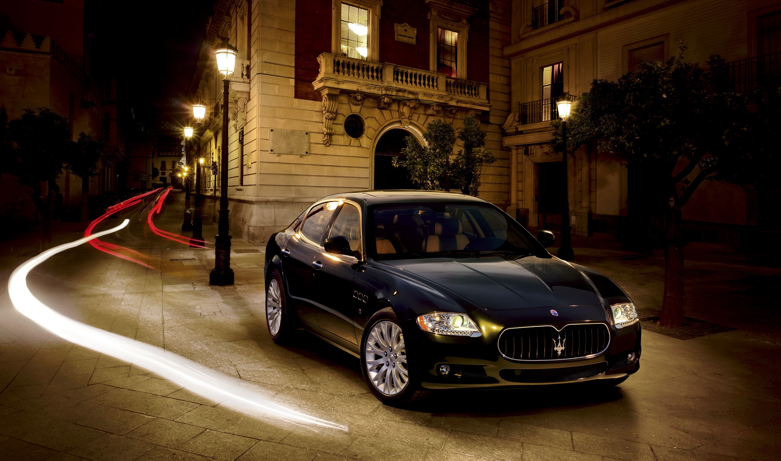 Maserati sedan on a street at night HD Wallpaper