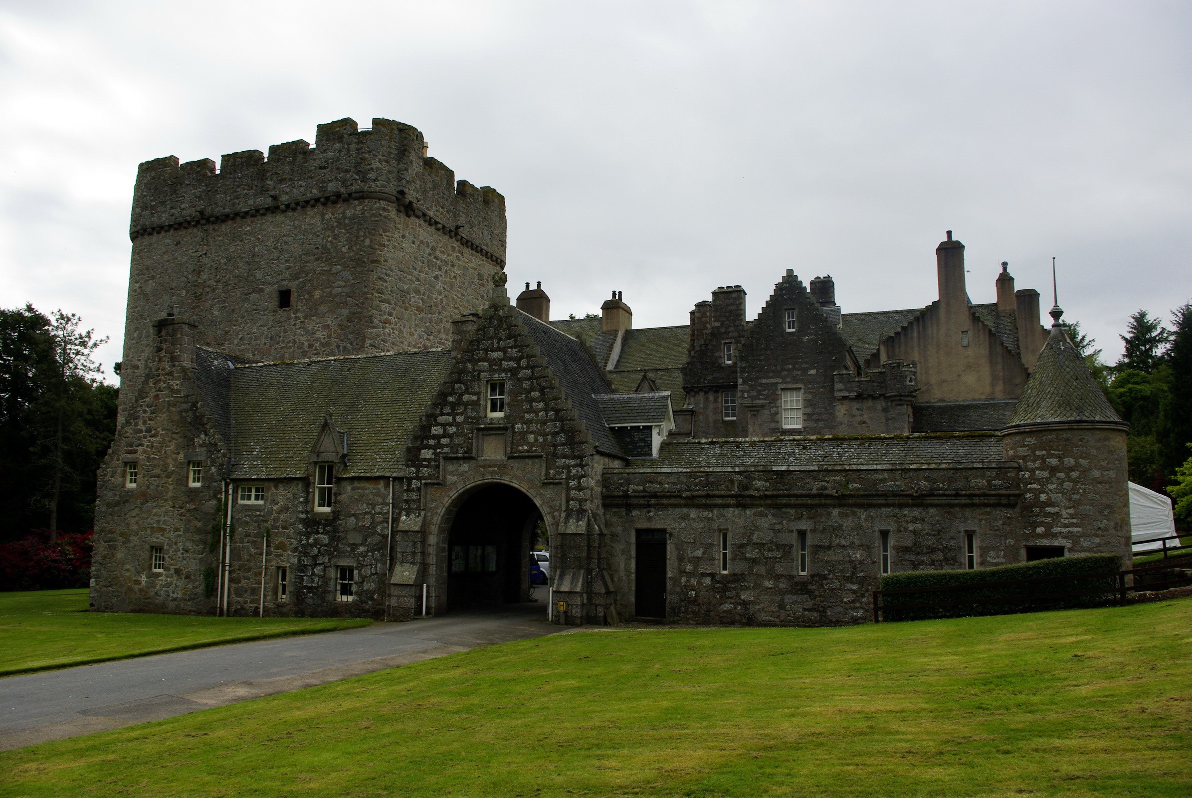 Castle with stone tower and arched entrance HD Wallpaper