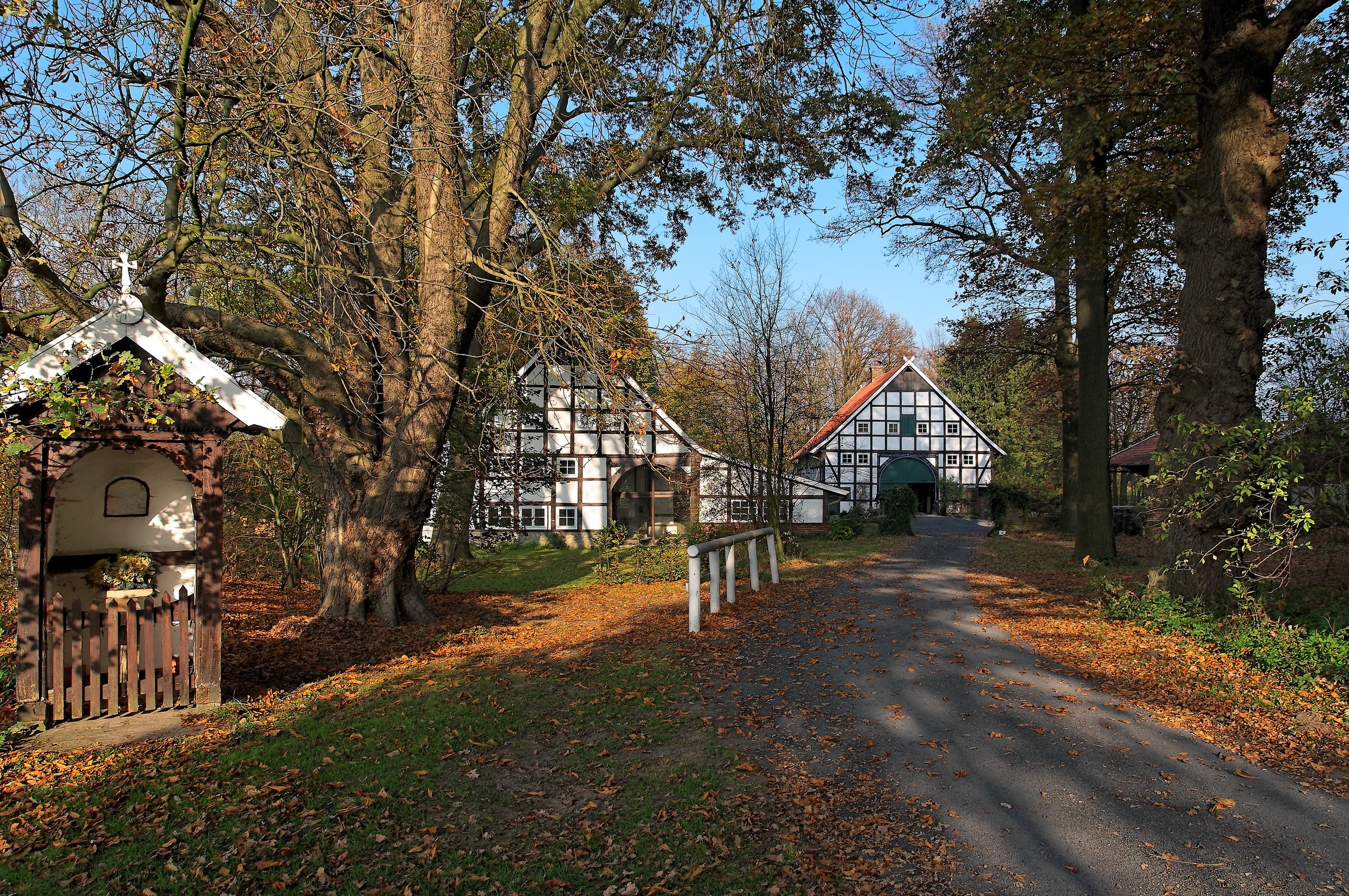 Half-timbered houses and a wayside shrine in Germany HD Wallpaper