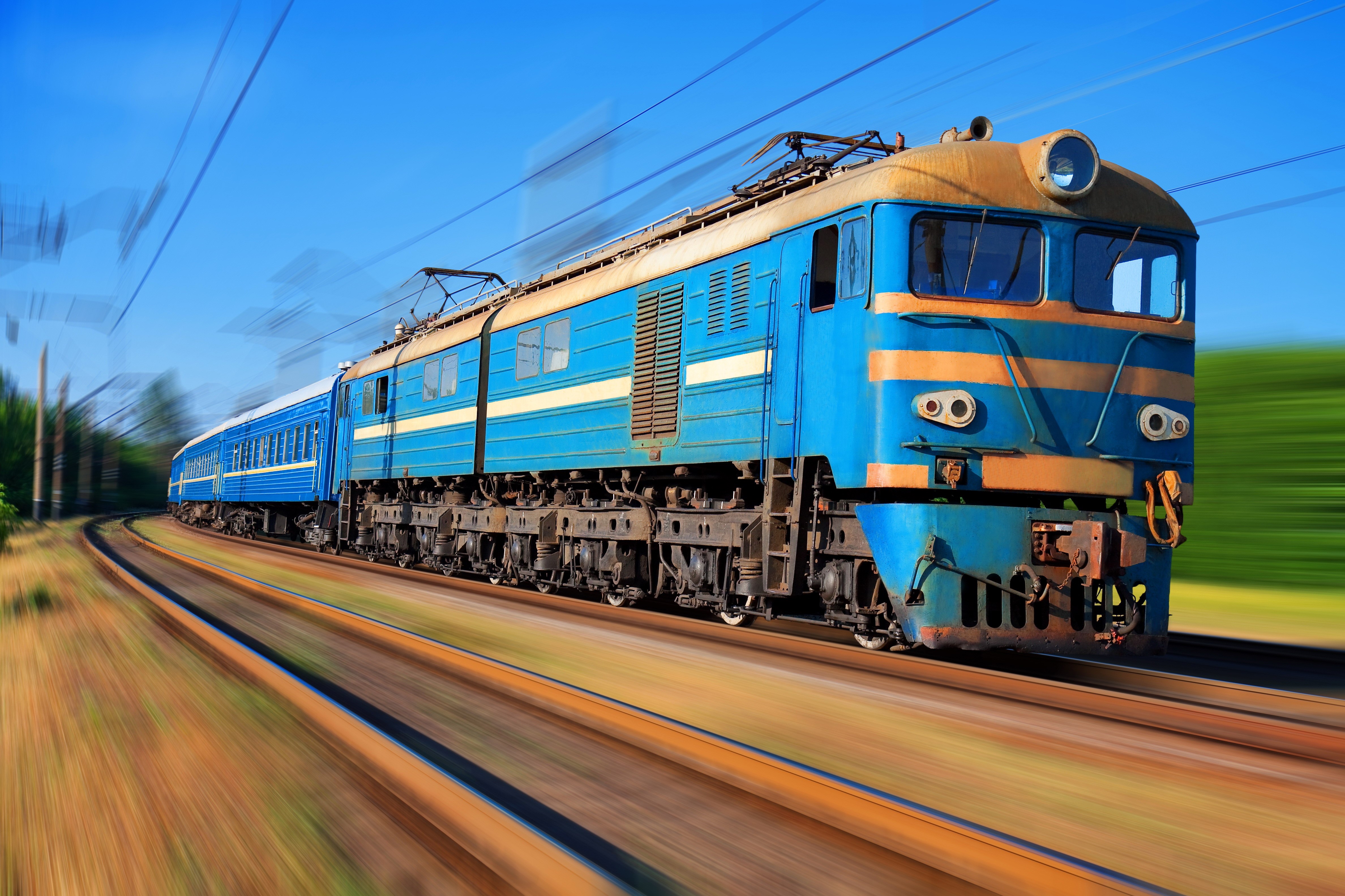 Blue and yellow electric train on tracks HD Wallpaper