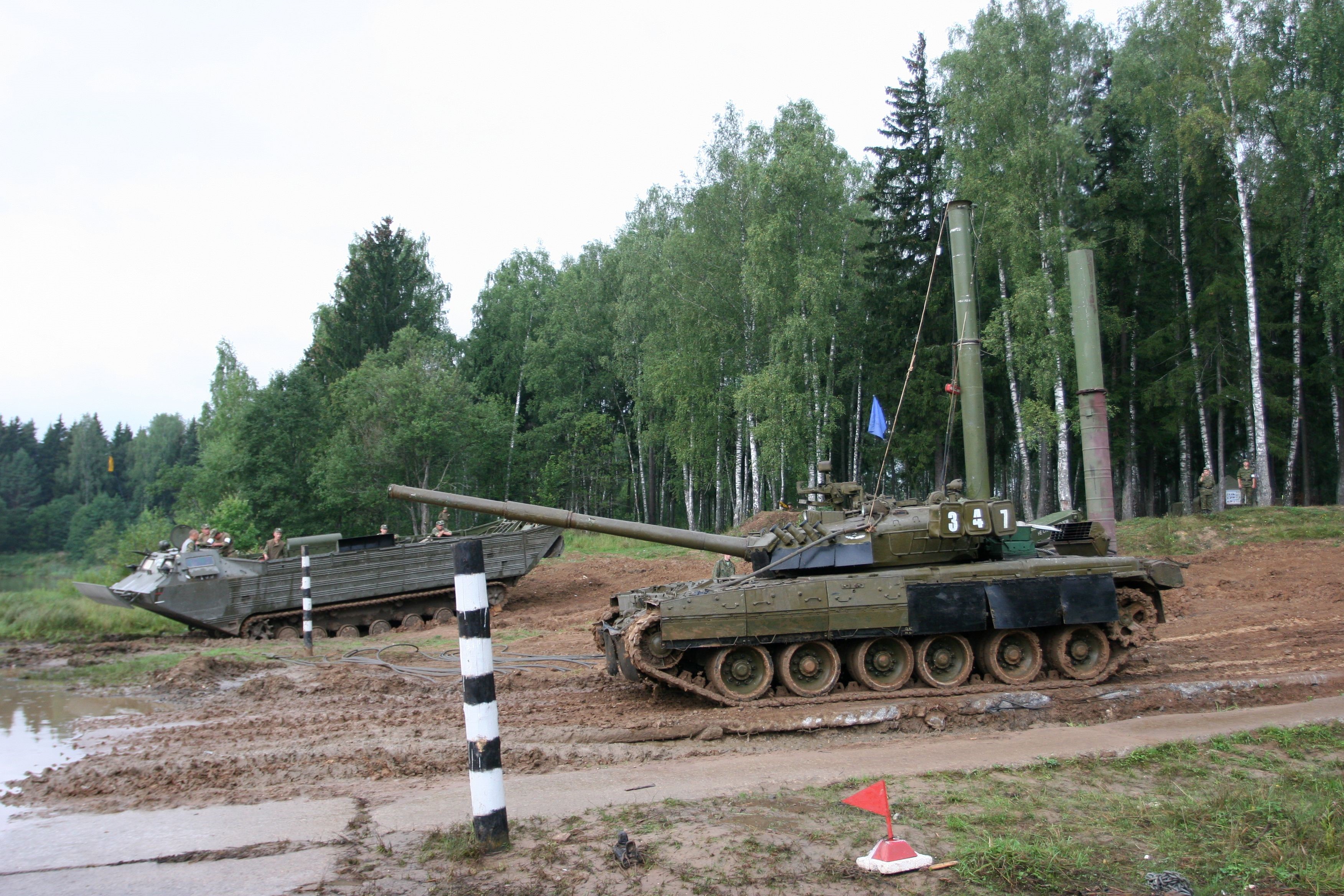 Two military vehicles in a wooded area HD Wallpaper