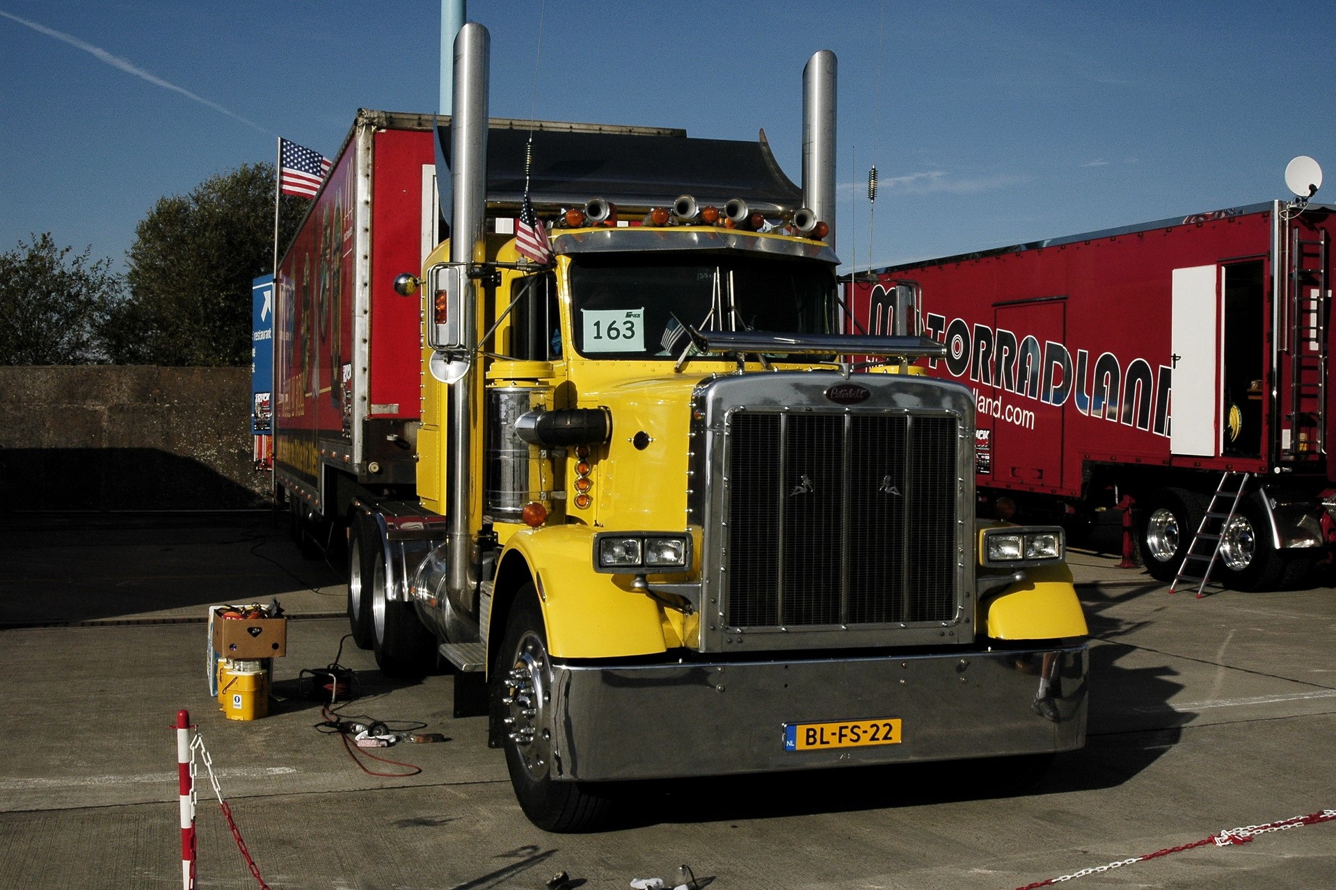Yellow Peterbilt truck with American flags HD Wallpaper