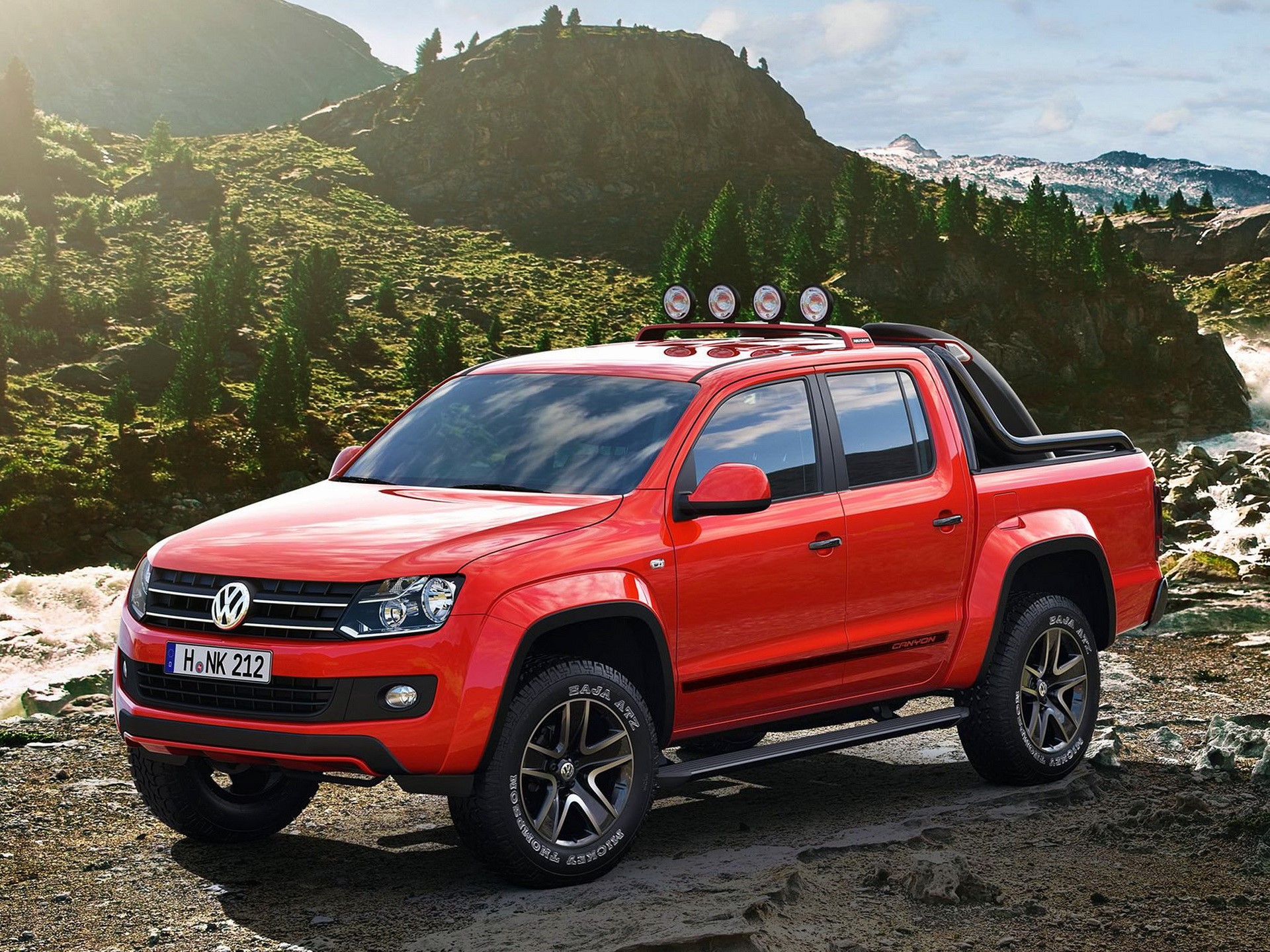 Red Volkswagen Amarok pickup truck in a mountainous landscape HD Wallpaper