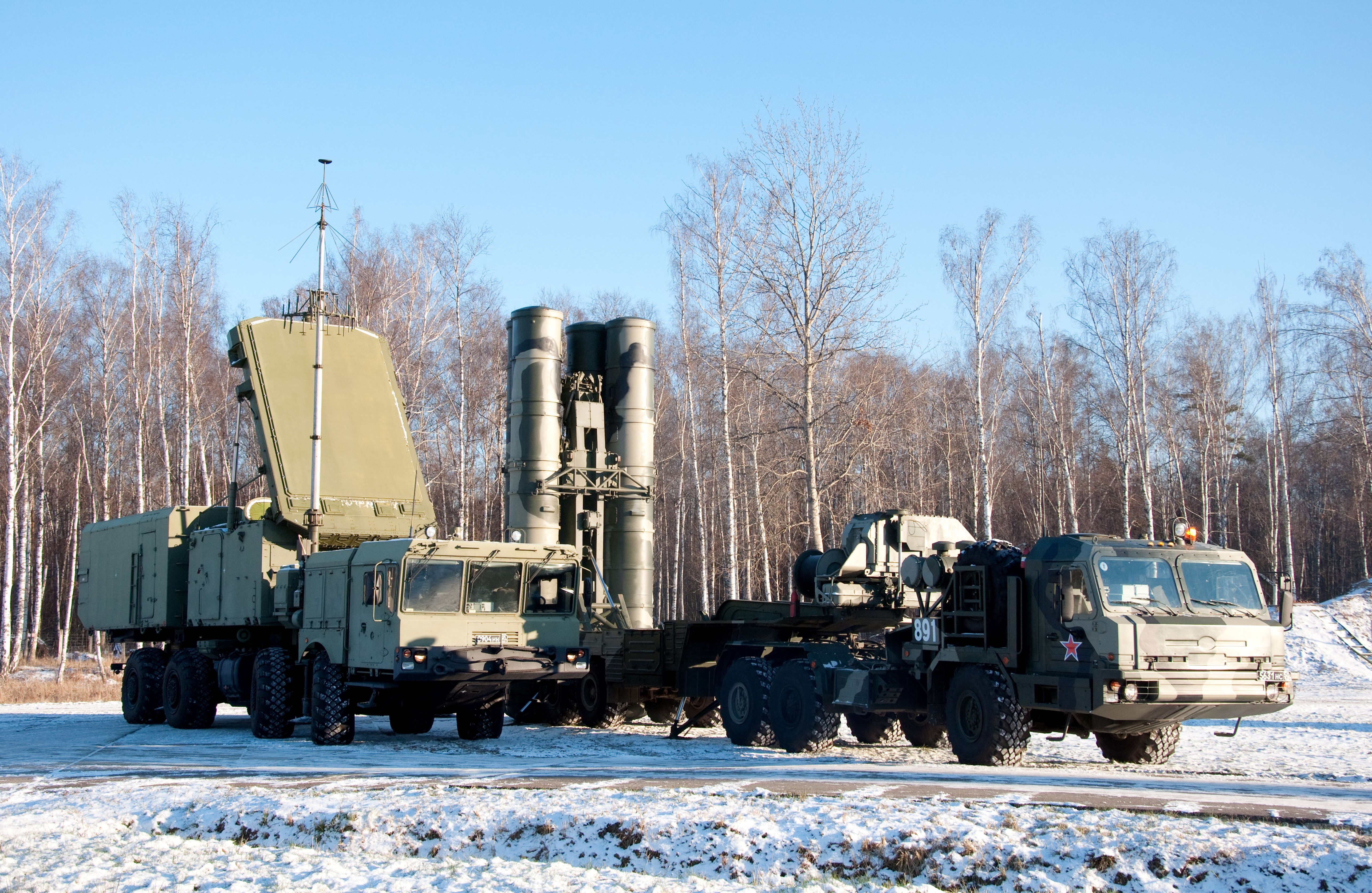 Missile launchers and radar system in a snowy field HD Wallpaper