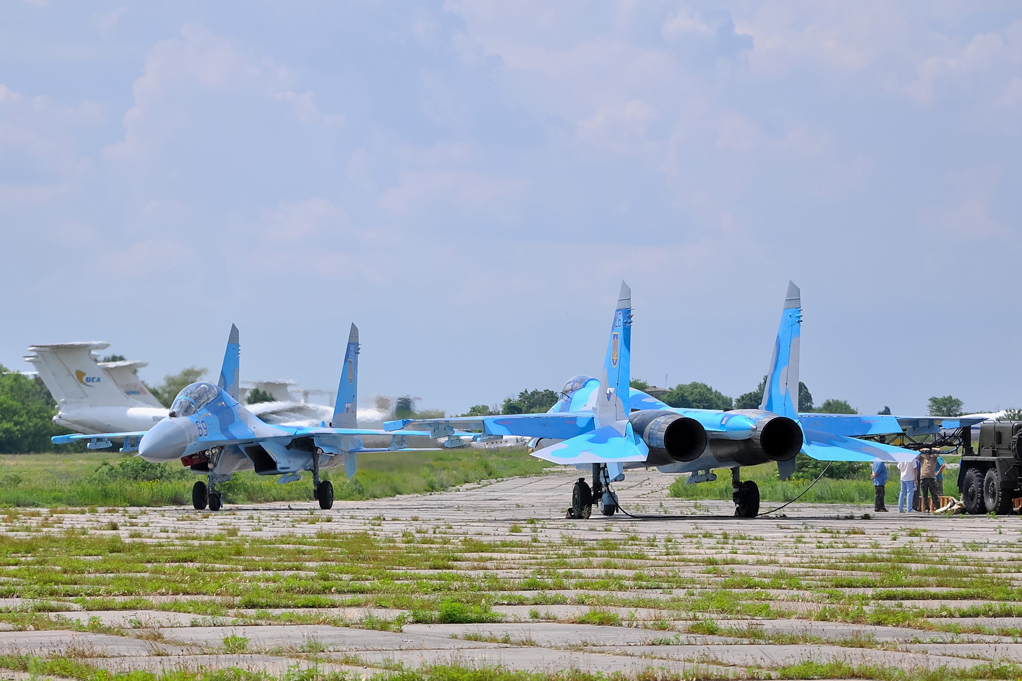 Two Sukhoi Su-27 fighter jets on tarmac HD Wallpaper
