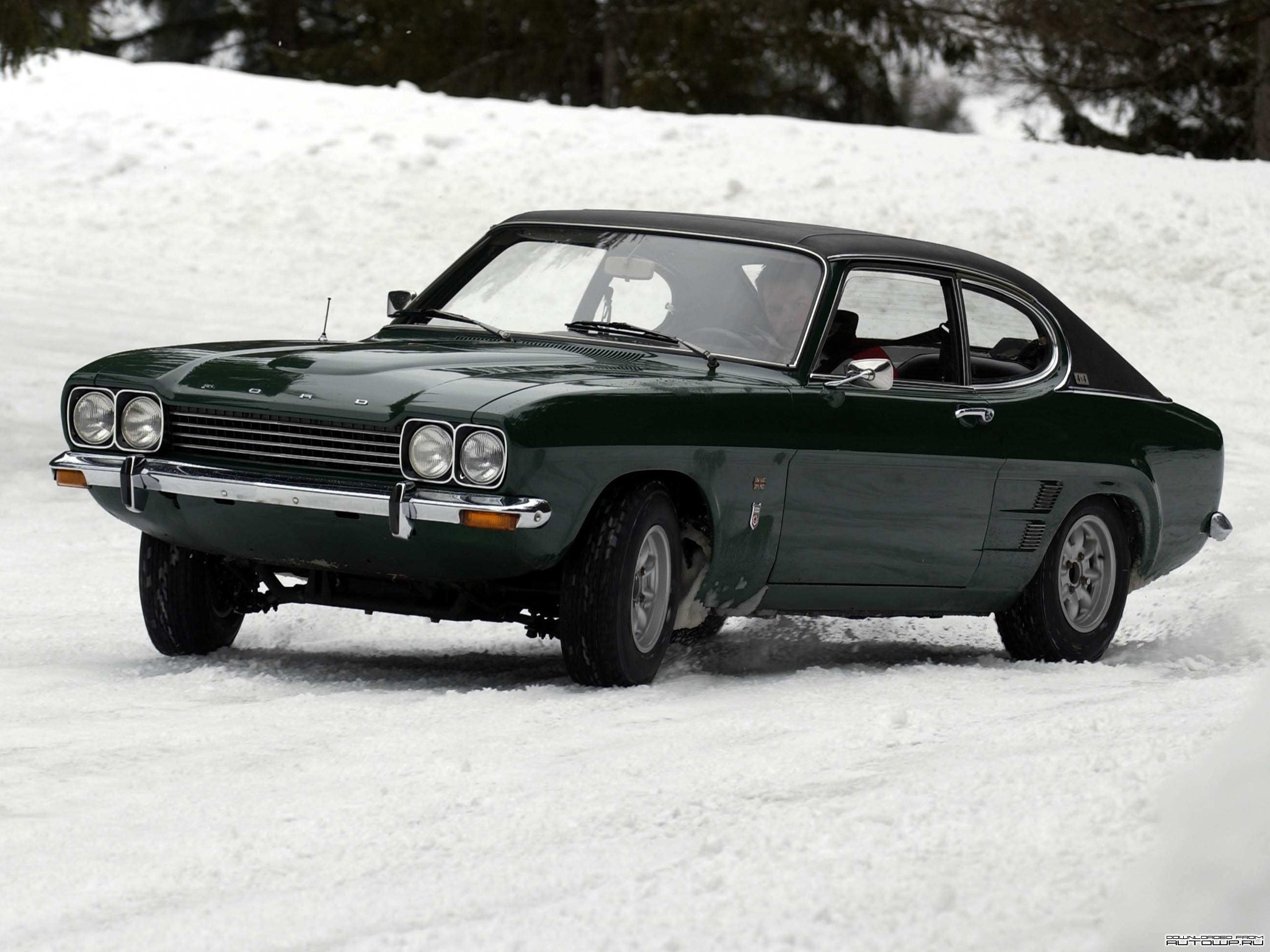 Green Ford Capri driving on snow HD Wallpaper