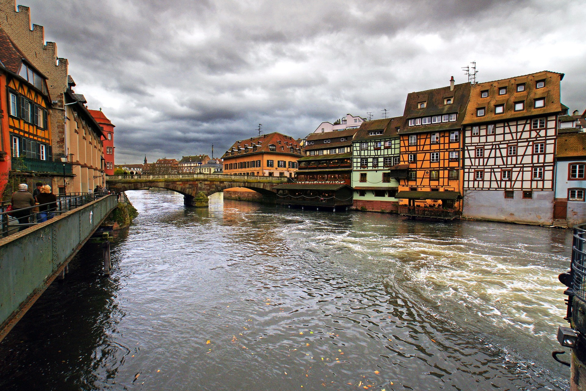 Half-timbered houses along a river in France HD Wallpaper
