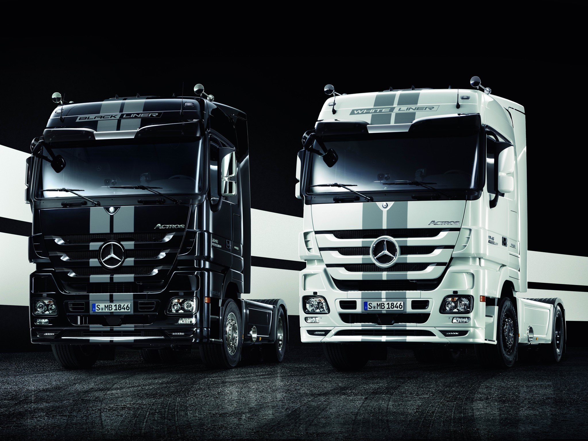 Two Mercedes-Benz Actros trucks, black and white HD Wallpaper