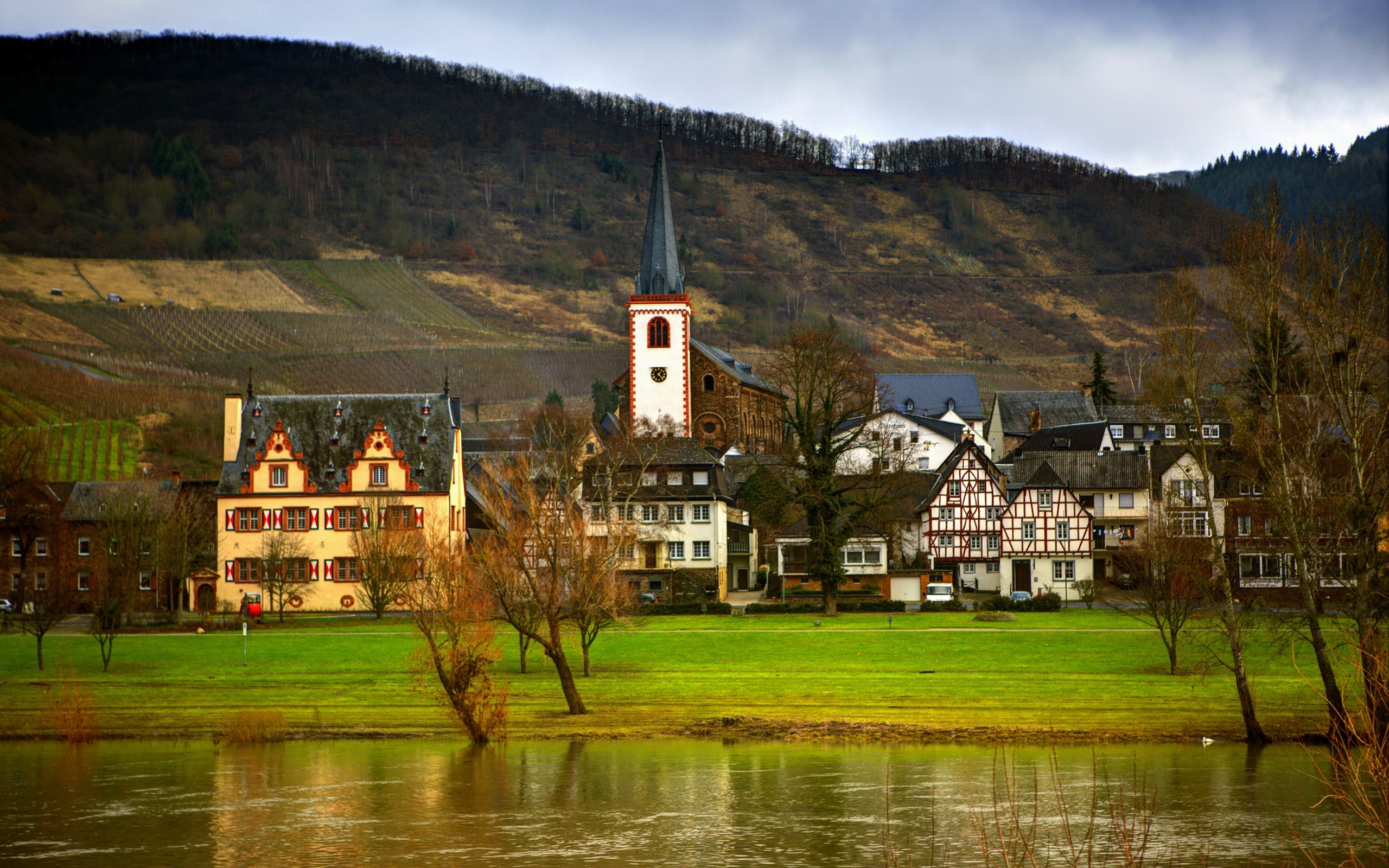 Village with church and river in Germany HD Wallpaper
