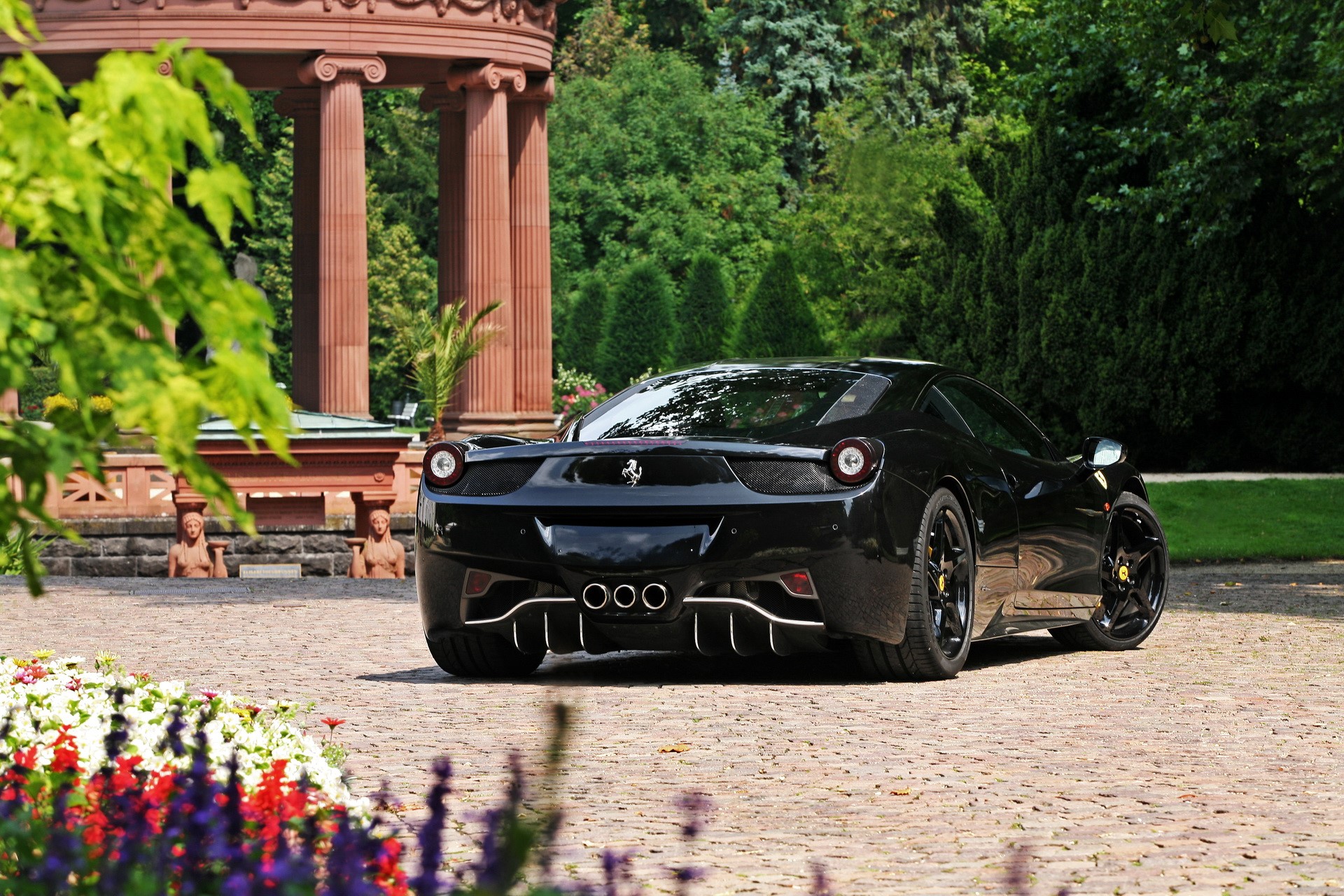 Black Ferrari parked near a classical pavilion HD Wallpaper