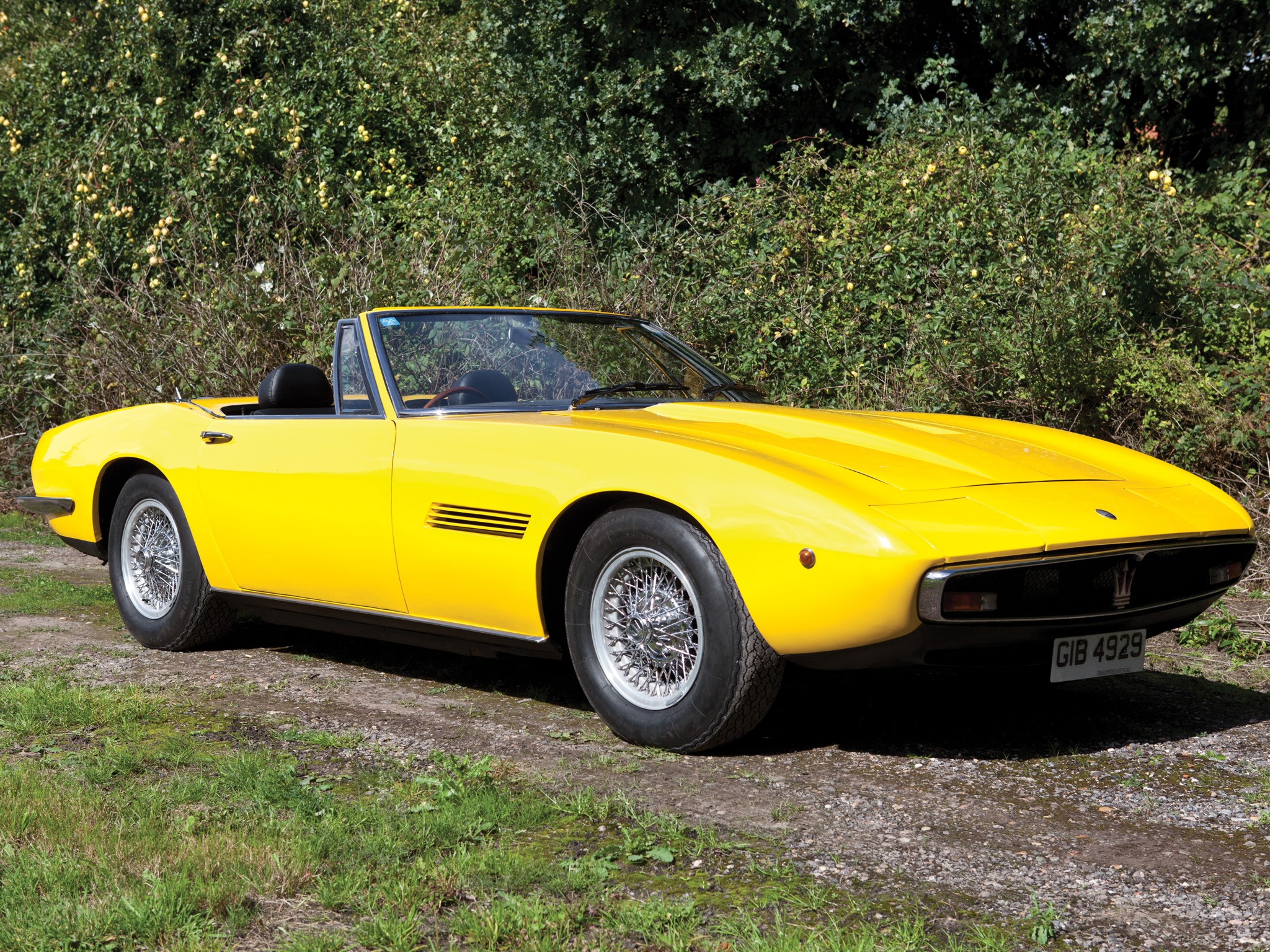 Yellow Maserati convertible car on a dirt road HD Wallpaper