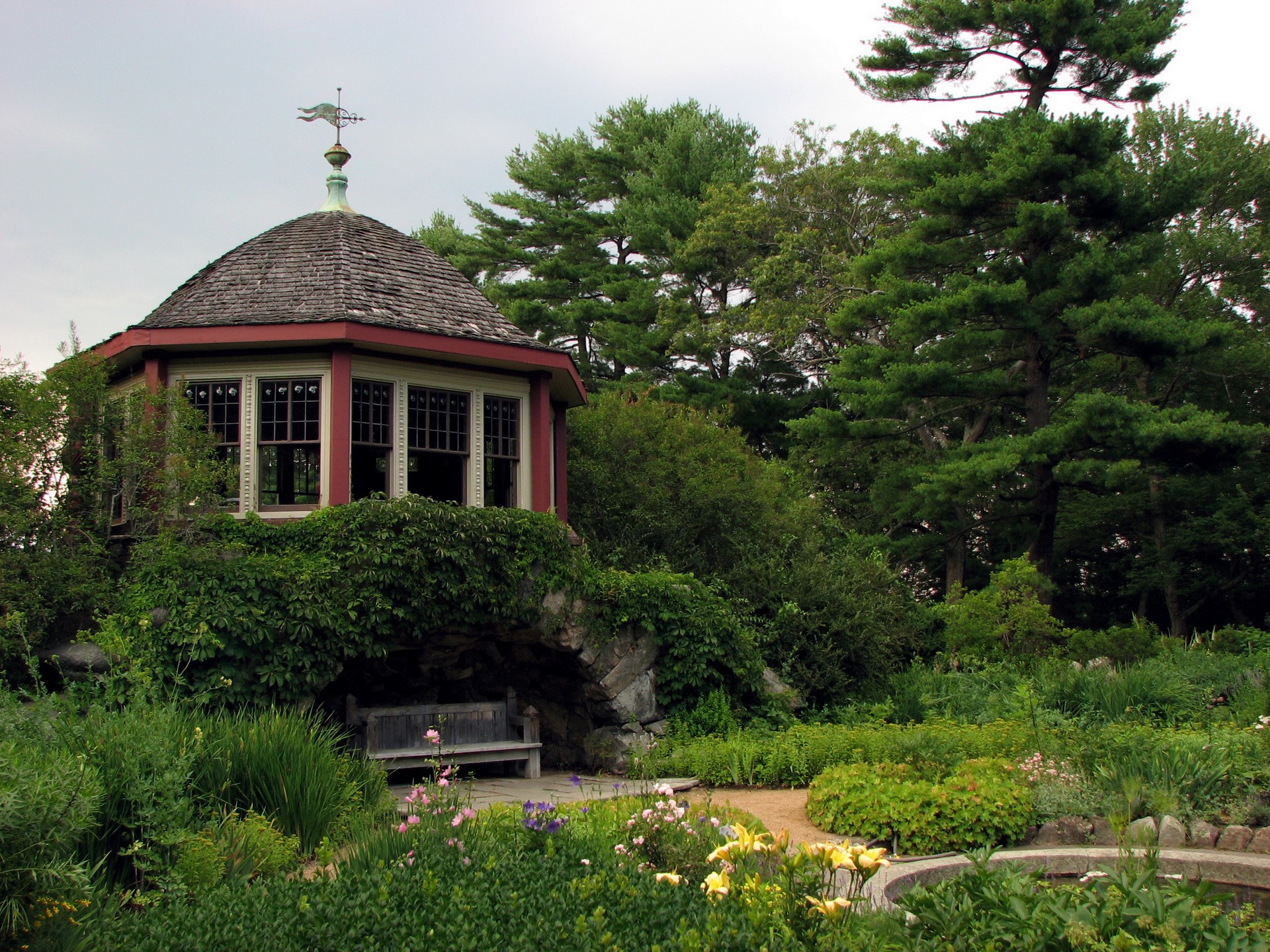 Gazebo in a lush garden with trees HD Wallpaper