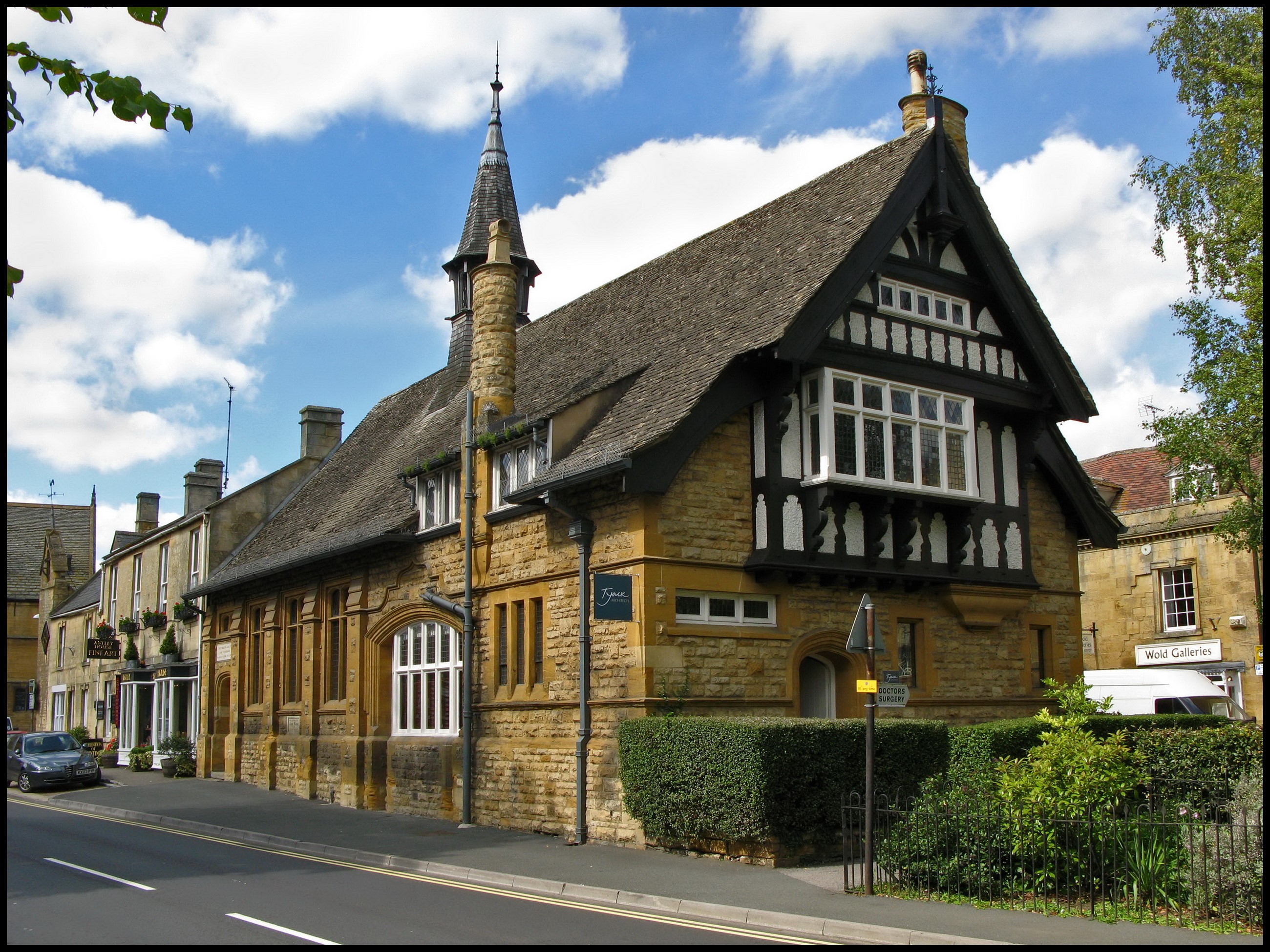 Building with spire and bay window in the United Kingdom HD Wallpaper