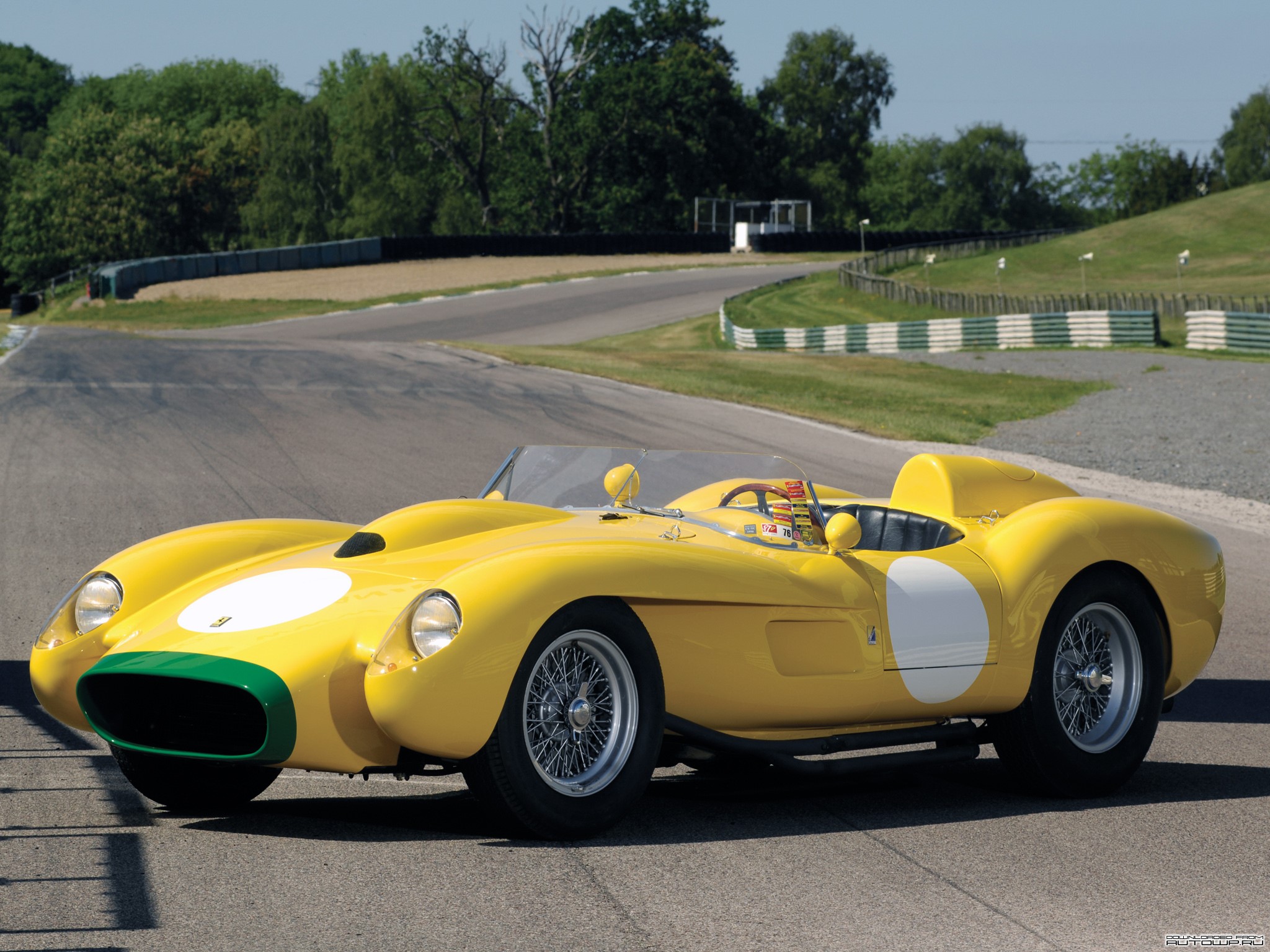 Yellow Ferrari 500 TRC Spider on a Race Track HD Wallpaper