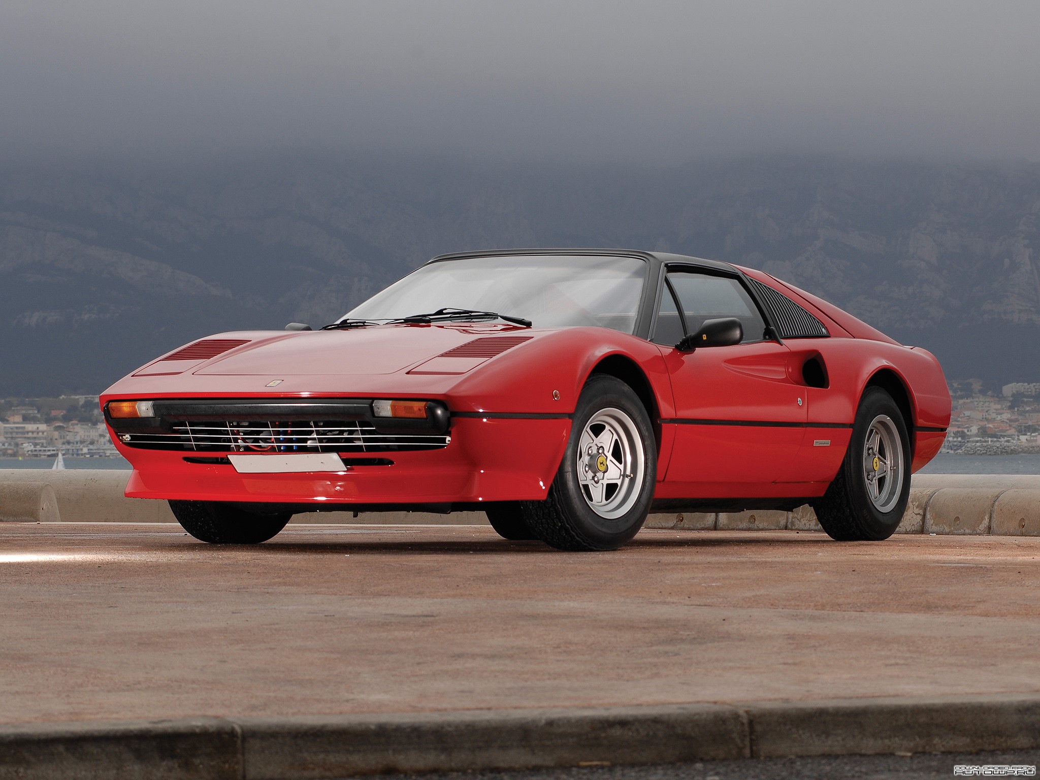 Red Ferrari 308 GTB parked by the sea HD Wallpaper